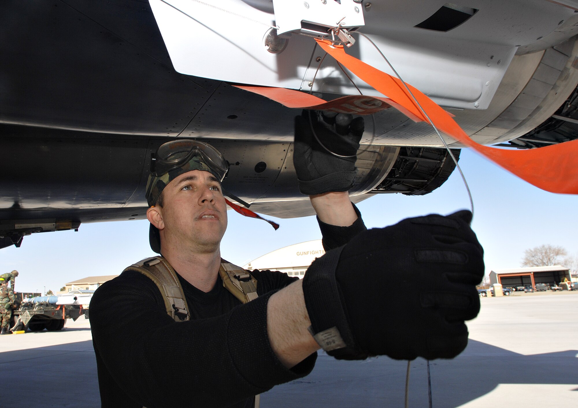 MOUNTAIN HOME AIR FORCE BASE, Idaho – Senior Airman Raul Agosto, 391st Aircraft Maintenance Unit weapons load technician, attaches an AIM-9 Sidewinder missile to an F-15E Strike Eagle during Exercise Sharpshooter 08-04.1 Feb. 28. Weapons load crews hustle to upload weapons to the jets after their arrival in the simulated deployed location to prepare the jets for their first mission. The 366th Fighter Wing conducts exercises to prepare personnel and equipment for the upcoming March 2008 Operational Readiness Inspection. (U.S. Air Force photo/ Airman 1st Class Ryan Crane) 