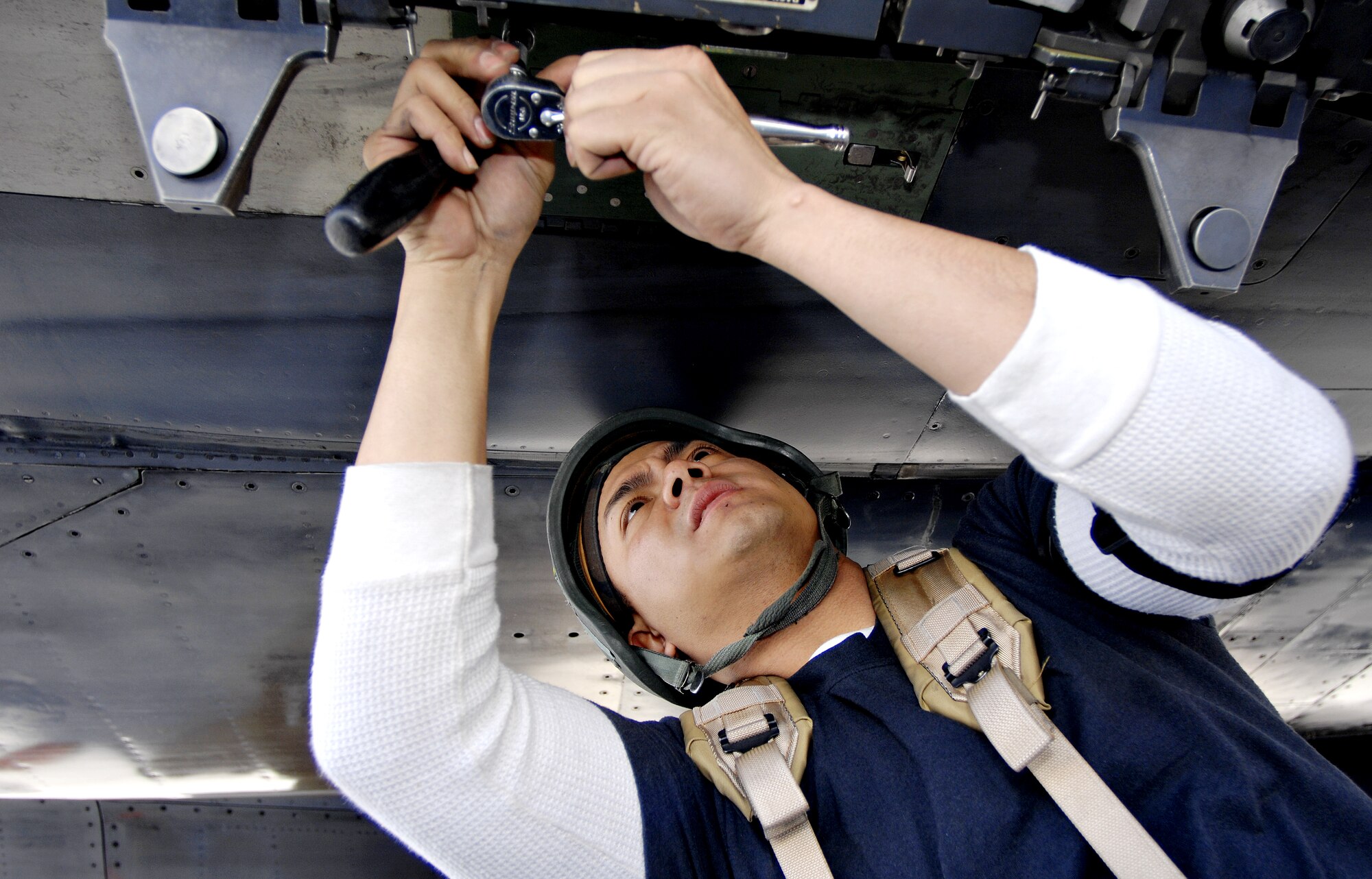 MOUNTAIN HOME AIR FORCE BASE, Idaho – Staff Sgt. Patrick Villanueva, 391st Aircraft Maintenance Unit weapons load technician, prepares an F-15E Strike Eagle for an AIM-9 Sidewinder missile during Exercise Sharpshooter 08-04.1 Feb. 28. Weapons load crews hustle to upload weapons to the jets after their arrival in the simulated deployed location to prepare the jets for their first mission. The 366th Fighter Wing conducts exercises to prepare personnel and equipment for the upcoming March 2008 Operational Readiness Inspection. (U.S. Air Force photo/ Airman 1st Class Ryan Crane) 