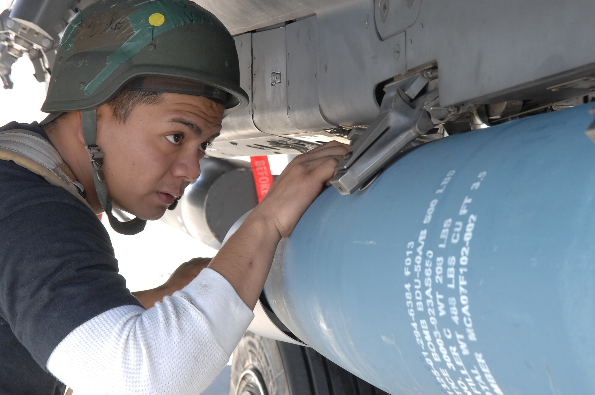 MOUNTAIN HOME AIR FORCE BASE, Idaho - Staff Sgt. Patrick Villanueva, 391st Aircraft Maintenance Unit weapons load technician, loads a cluster bomb unit onto an F-15E Strike Eagle following the recovery of the aircraft during Exercise Sharpshooter 08-04.1 Feb. 28. The 366th Fighter Wing conducts exercises to prepare personnel and equipment for the upcoming March 2008 Operational Readiness Inspection. (U.S. Air Force photo by Staff Sgt. Kathy Parker) 