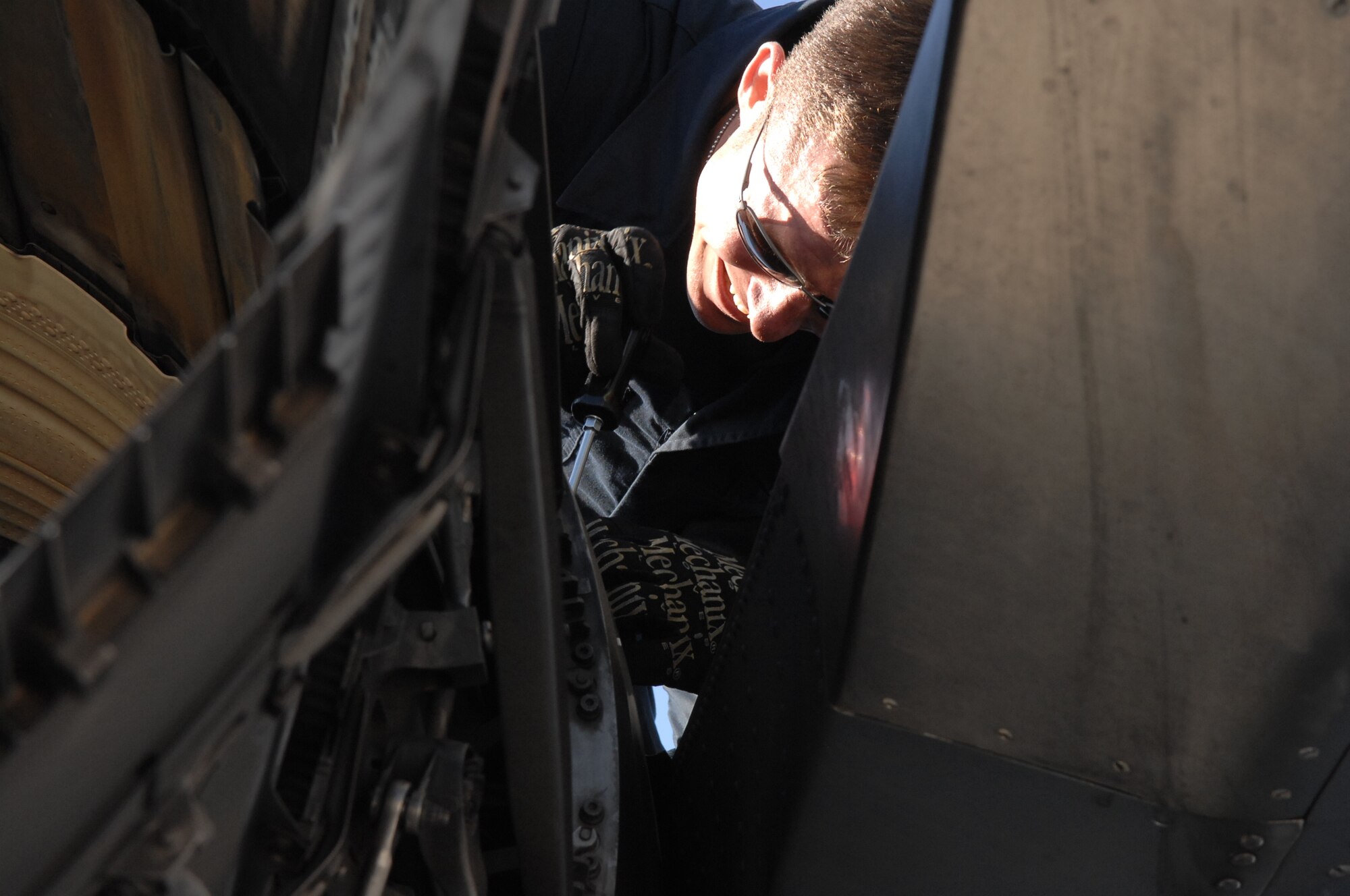 MOUNTAIN HOME AIR FORCE BASE, Idaho - Staff Sgt. Anthony Barrett, 391st Aircraft Maintenance Unit crew chief, adjusts screws on the engine of an F-15E Strike Eagle following the recovery of the aircraft during Exercise Sharpshooter 08-04.1 Feb. 28. The 366th Fighter Wing conducts exercises to prepare personnel and equipment for the upcoming March 2008 Operational Readiness Inspection. (U.S. Air Force photo by Staff Sgt. Kathy Parker) 