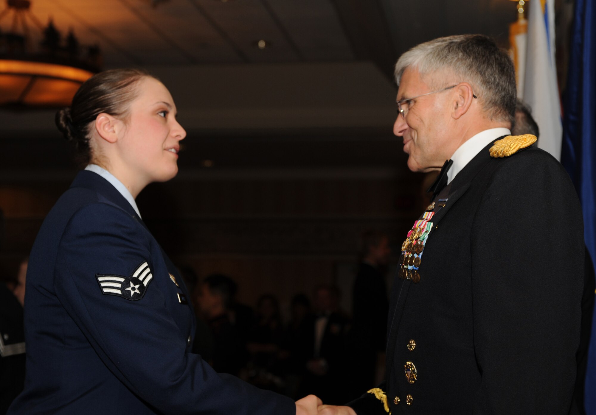 ELMENDORF AIR FORCE BASE, Alaska -- Gen. George Casey, Chief of Staff of the U.S. Army, shakes hands with Senior Airman Charity Orriss, 168th Security Forces Squadron, at the Armed Services YMCA?s 31st Annual Salute to the Military at the Sheraton Hotel in Anchorage Feb. 22. Senator Lisa Murkowski, (R-Alaska), Senator Ted Stevens, (R-Alaska), and Anchorage Mayor Mark Begich were on hand to attend the event. The event was to honor the more than 250 junior enlisted members who attended. (U.S. Air Force photo by Airman 1st Class Matt Owens)

