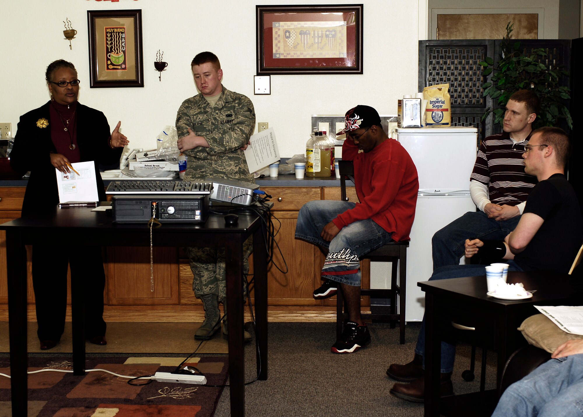 FAIRCHILD AIR FORCE BASE, Wash. -- Della Gooding, Airmen and Family Readiness Center community readiness consultant, informs Airmen about the many investment opportunities at the newly refurnished Airmen’s Lounge on Feb. 27. The briefing familiarized Airmen about stocks, savings bonds and shared tips to ensure a successful budgeting future. (U.S. Air Force photo / Airmen 1st Class Melissa Barnett)
