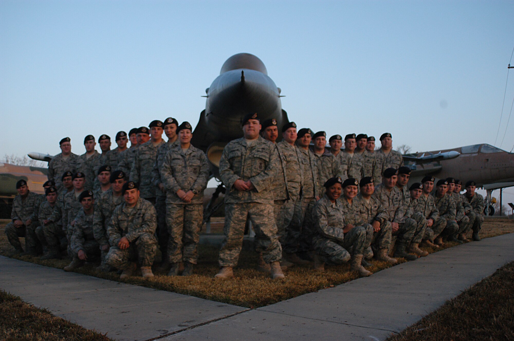 Security forces assigned to units at the Naval Air Station Joint Reserve Base Fort Worth, Texas, pose at the 301st Fighter Wing's Air Park prior to deploying to Southwest Asia. Supportive community members handed out phone cards to 810th and 301st SF troops and their family members totaling more than $7,400. (U.S. Air Force Photo/Laura Dermarderosian-Smith)                   