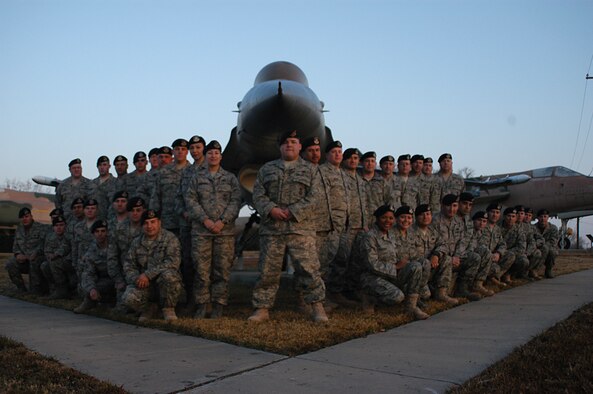 Security forces assigned to units at the Naval Air Station Joint Reserve Base Fort Worth, Texas, pose at the 301st Fighter Wing's Air Park prior to deploying to Southwest Asia. Supportive community members handed out phone cards to 810th and 301st SF troops and their family members totaling more than $7,400. (U.S. Air Force Photo/Laura Dermarderosian-Smith)                   