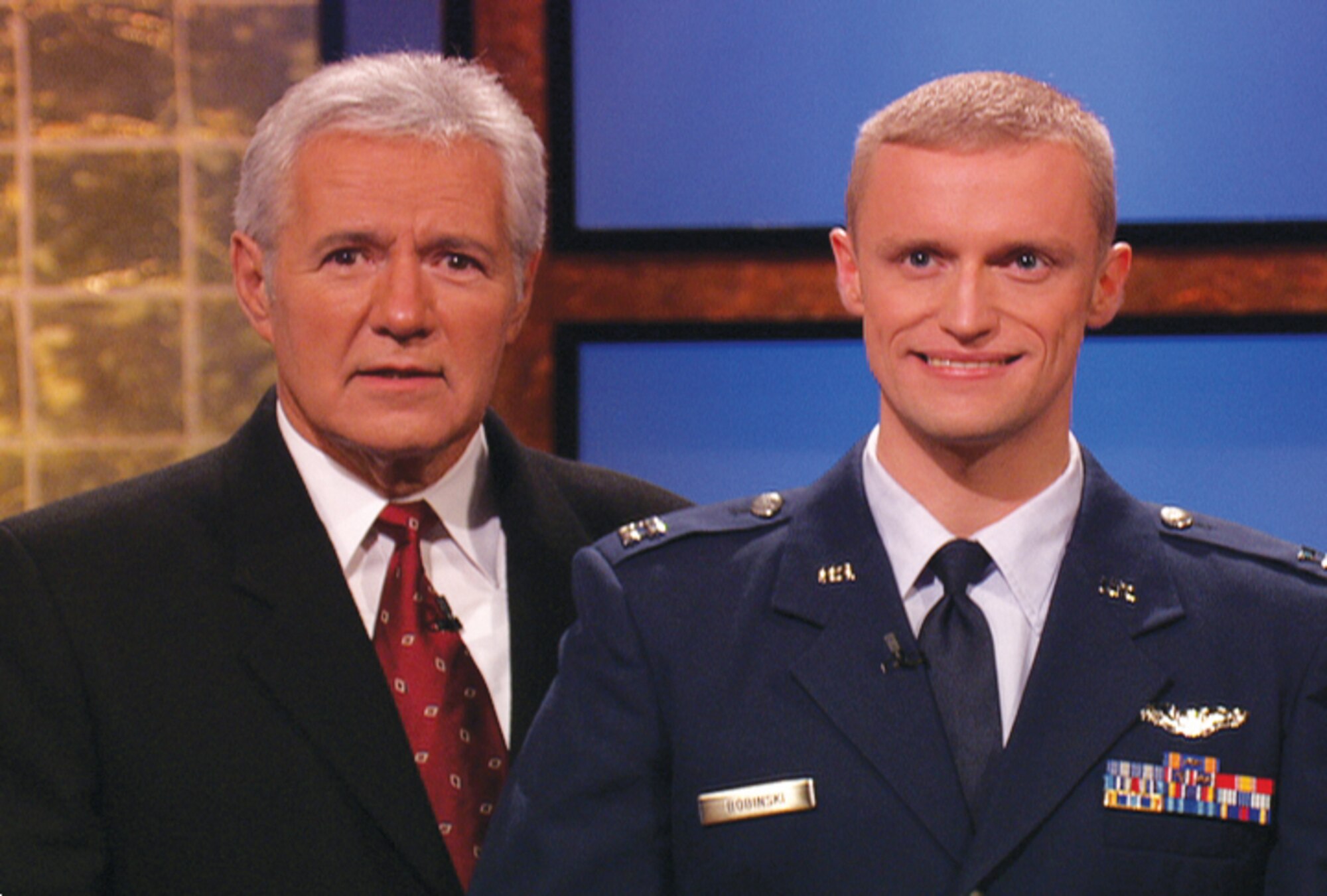 'Jeopardy!' host Alex Trebek and Capt. Timothy Bobinski, 19th Fighter Squadron chief of safety, on the set of  'America's Favorite Quiz Show.' Captain Bobinski was a contestant on the show in November. The episode is due to air March 6. (Photo courtesy of Sony Pictures Television)