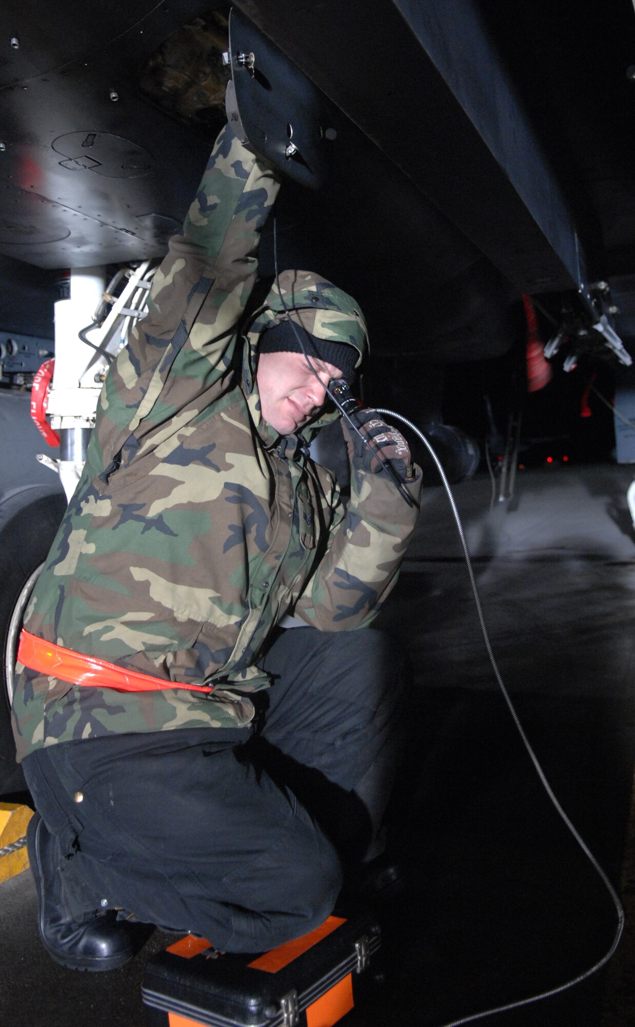 MOUNTAIN HOME AIR FORCE BASE, Idaho-- Staff Sgt. Mason Mayor, 391st Aircraft Maintenance Unit crew chief, verifies the serial number on a central gear box located inside an F-15E Strike Eagle during Exercise Sharpshooter 08-04 Feb. 23. The 391st crew chiefs verify serial numbers to insure all parts are correct.  The 366th Fighter Wing conducts exercises to prepare personnel and equipment for the upcoming March 2008 Operational Readiness Inspection. (U.S. Air Force photo/ Airman 1st Class Stephany Miller) 