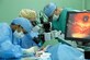 Opthomology technician Senior Airman Shirley Taylor (left) prepares instruments as Dr. (Capt.) Megan McChesney and Dr. (Lt. Col.) Dave Zumbro carefully remove a cataract from the eye of a patient during the Tela, Honduras MEDRETE Feb. 18-29. Cataract removals make up the largest portion of the procedures U.S. military doctors perform on elderly patients receiving care during eye surgical MEDRETEs. (U.S. Air Force photo by Tech. Sgt. William Farrow)