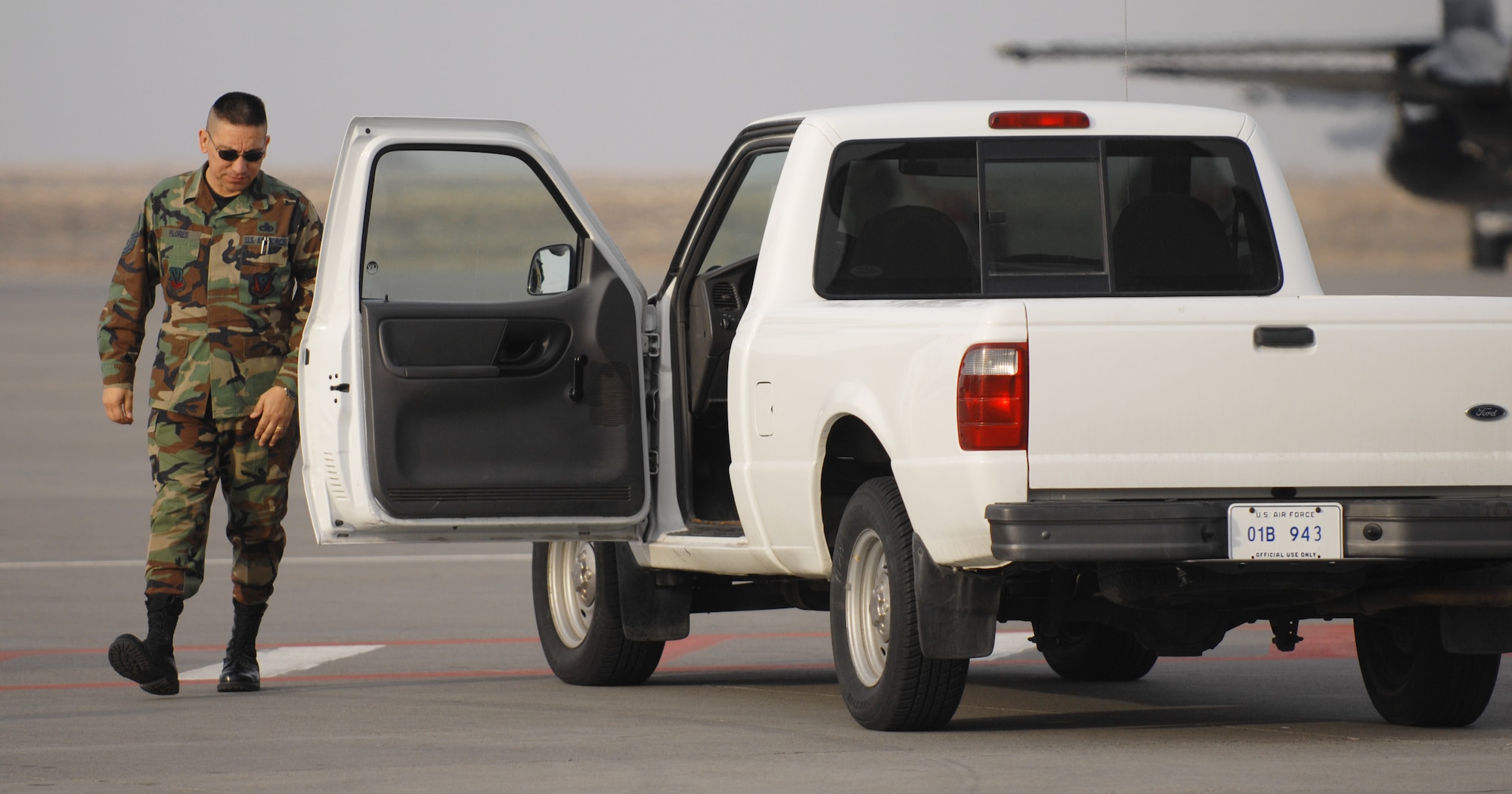 MOUNTAIN HOME AIR FORCE BASE, Idaho – Senior Master Sgt. Alvin Flores, 366th Maintenance Group quality assurance chief, does a quick walk around of his vehicle to check for any foreign objects that may have gotten lodged in the tires of his truck during Exercise Sharpshooter 08-04.1 Feb. 28. Foreign object damage on the flightline is a high priority and can be greatly reduced by eliminating it before it reaches the jets.  The 366th Fighter Wing conducts exercises to prepare personnel and equipment for the upcoming March 2008 Operational Readiness Inspection. (U.S. Air Force photo/ Airman 1st Class Ryan Crane) 