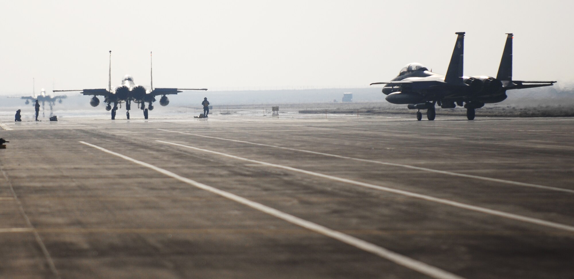 MOUNTAIN HOME AIR FORCE BASE, Idaho - Three F-15E Strike Eagles from the 389th Fighter Squadron, taxi to the end of the runway for their final inspection prior to their takeoff to the simulated deployed location during Exercise Sharpshooter 08-04.1 Feb. 28. During the Phase I exercise, a main objective is to deploy a predetermined number of jets from each squadron to the simulated deployed location.  The 366th Fighter Wing conducts exercises to prepare personnel and equipment for the upcoming March 2008 Operational Readiness Inspection. (U.S. Air Force photo/ Airman 1st Class Ryan Crane)