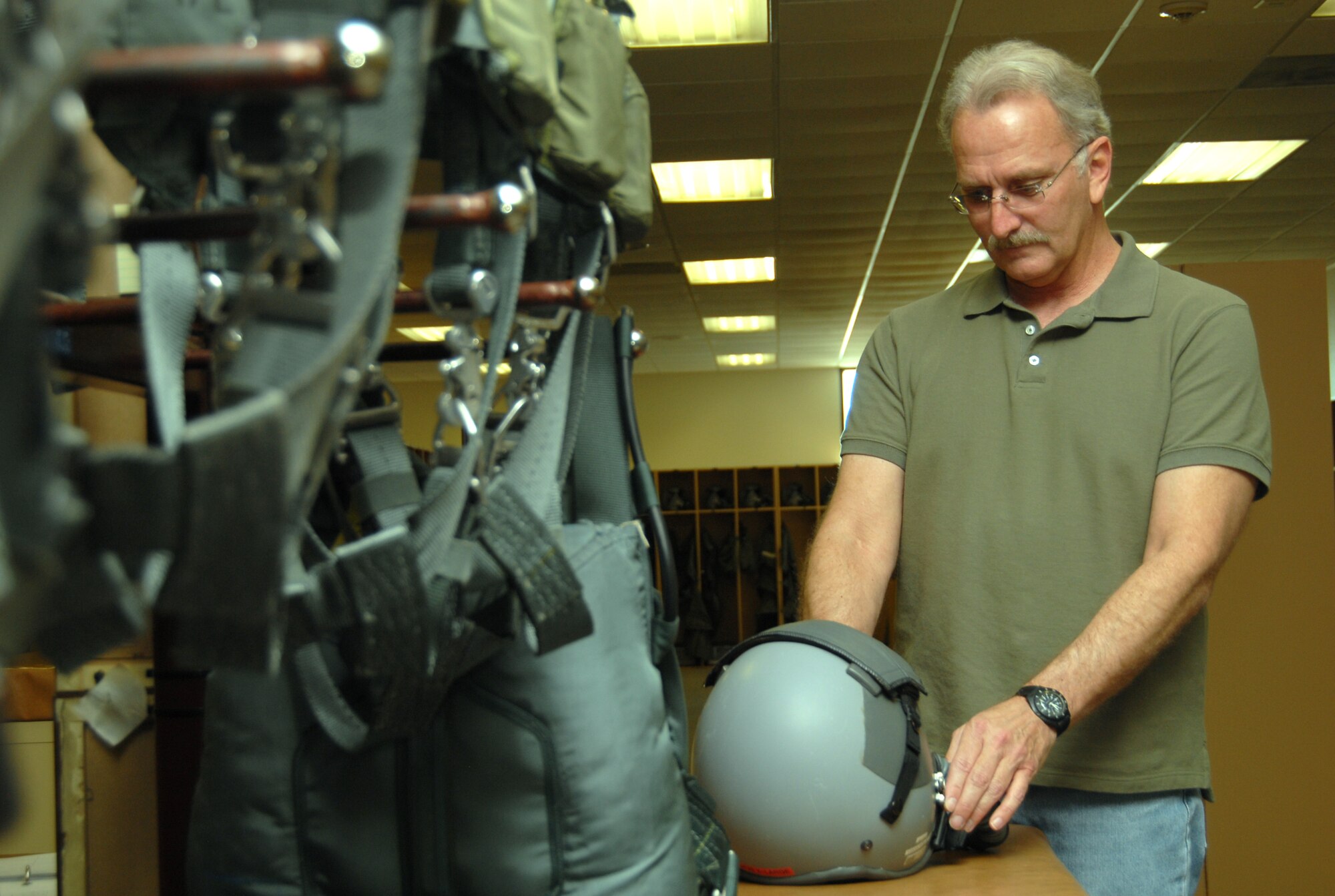 Mark Kraus, 412th Operation Support Squadron aircrew flight equipment technician, is the Team Edwards Trades and Labor Civilian of the Quarter. Among some of his accomplishments during the quarter, Mr. Kraus inspected and serviced life support equipment for four F-22 Raptors and led the aircraft's life support section. (Air Force photo by Senior Airman Julius Delos Reyes)