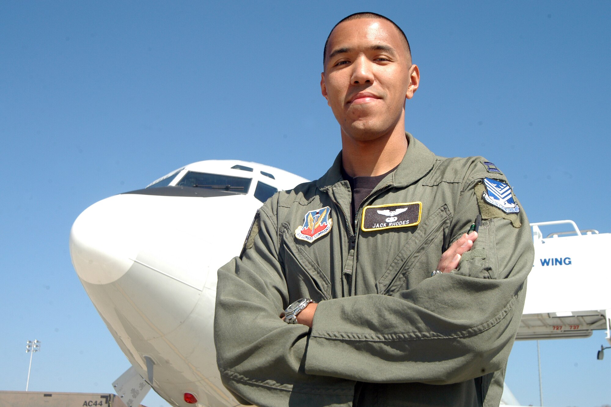 Captain Jack Rhodes, an instructor air weapons officer for Joint Surveillance and Target Attack Radar System aircraft in the 330th Combat Training Squadron in the 116th Air Control Wing, stands in front of an E-8C JSTARS aircraft. The captain is one of 32 officers Air Force-wide to be accepted into the Specialized Undergraduate Pilot Training program.  U.S. Air Force photo by Sue Sapp 