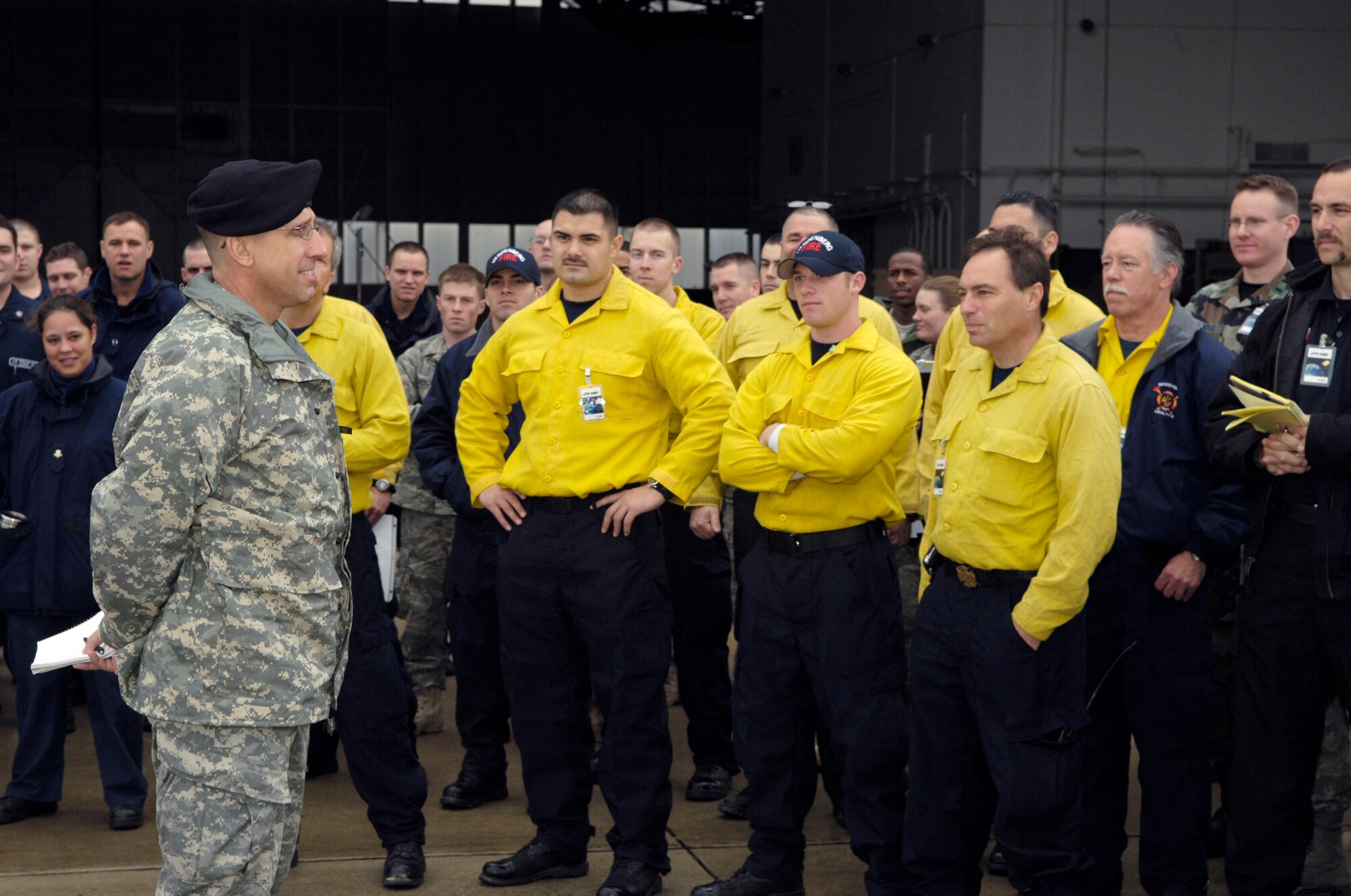 Army Brig. Gen. Jeff Horne briefs the task force members about their mission in the satellite recovery Feb. 20 at McGuire Air Force Base, N.J. The JTF was the recovery part of Operation Burnt Frost which covers the shoot down of the errant satellite loaded with hydrazine. The supplies were for 15 federal agencies tasked to handle the environmental effects of the satellite's reentry into the atmosphere. General Horne is the Joint Task Force commander. (U.S. Air Force photo/Kenn Mann) 
