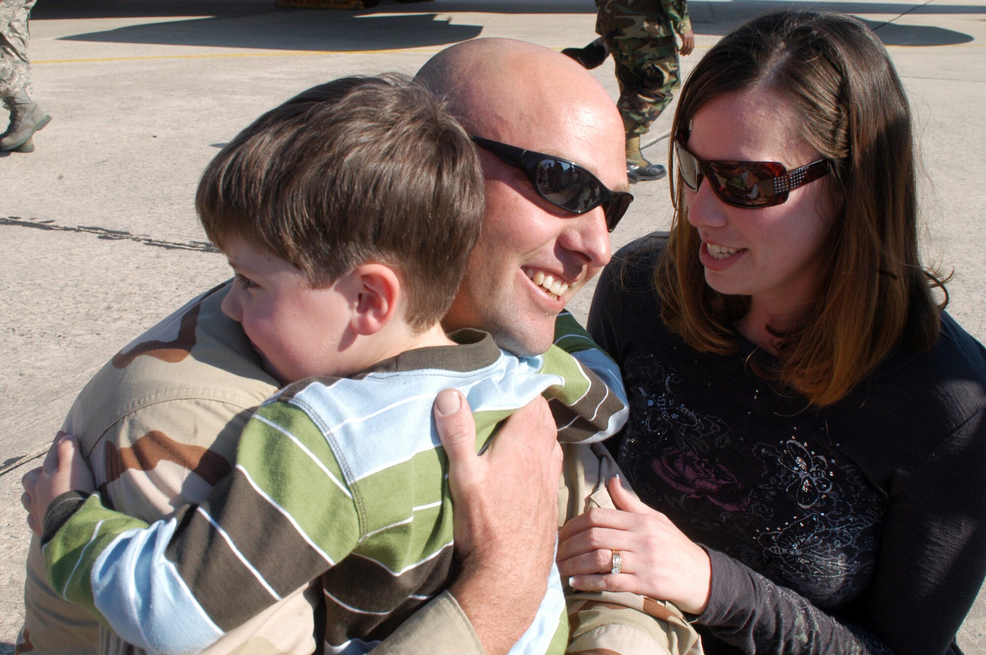 SSgt. Timothy Swinney is excited to see his son Isaac, 3 1/2, and wife, Jessica. Sgt. Swinney returned Feb. 25  with the 19th Air Refueling Group Black Knights, who were returning from the unit’s last deployment tasking. U. S. Air Force photo by Sue Sapp  