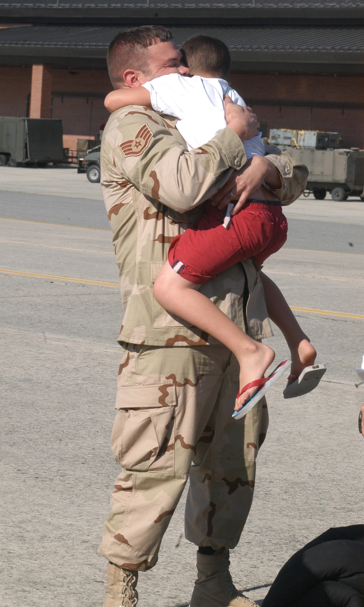 SSgt. Chris Cisco gets a big hug from his 5 year old son Trevor.  Eleven Airmen from the 19th Air Refueling Group Black Knights, who were deployed, returned from the unit’s last deployment tasking. U. S. Air Force photo by Sue Sapp  