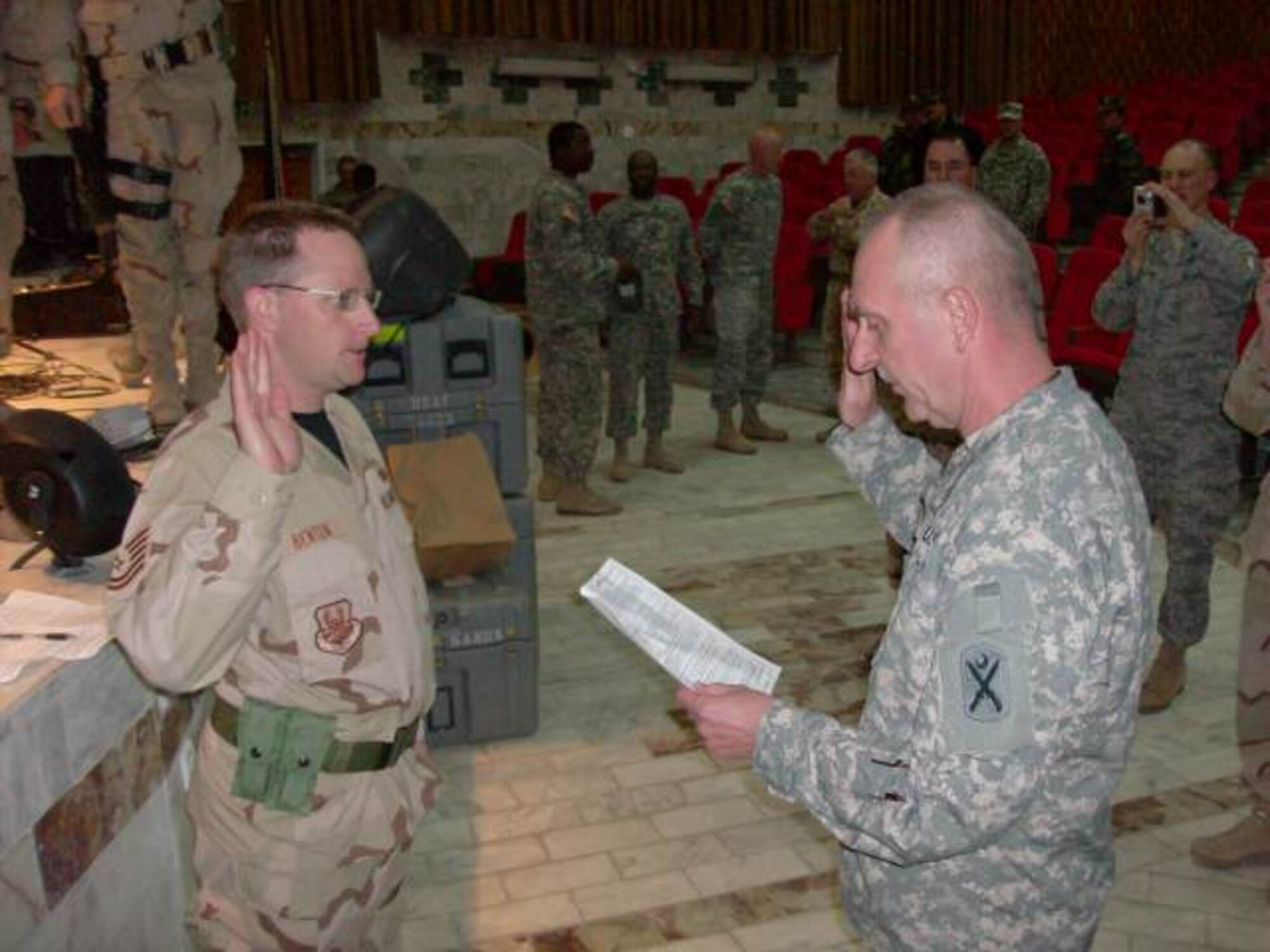 TSgt Andrew Benton of the USAF Academy Band re-enlisted in the United States Air Force during a ceremony at the Kabul Military Training Center (KMTC) on February 21st.