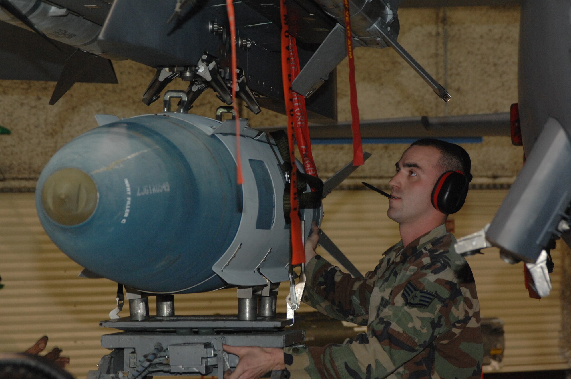 Staff Sergeant Brad Perkins, 333rd Aircraft Maintenance Unit, Seymour Johnson Air Force Base, Goldsboro, North Carolina, helps to put a Guided Bomb Unit into place during the 2008 Weapons Load Competition. The Weapons Load Competition held on base to showcase airmen and their jobs skills. (U.S. Air force photo by Airman First Class Jonathon Williams)(released) 