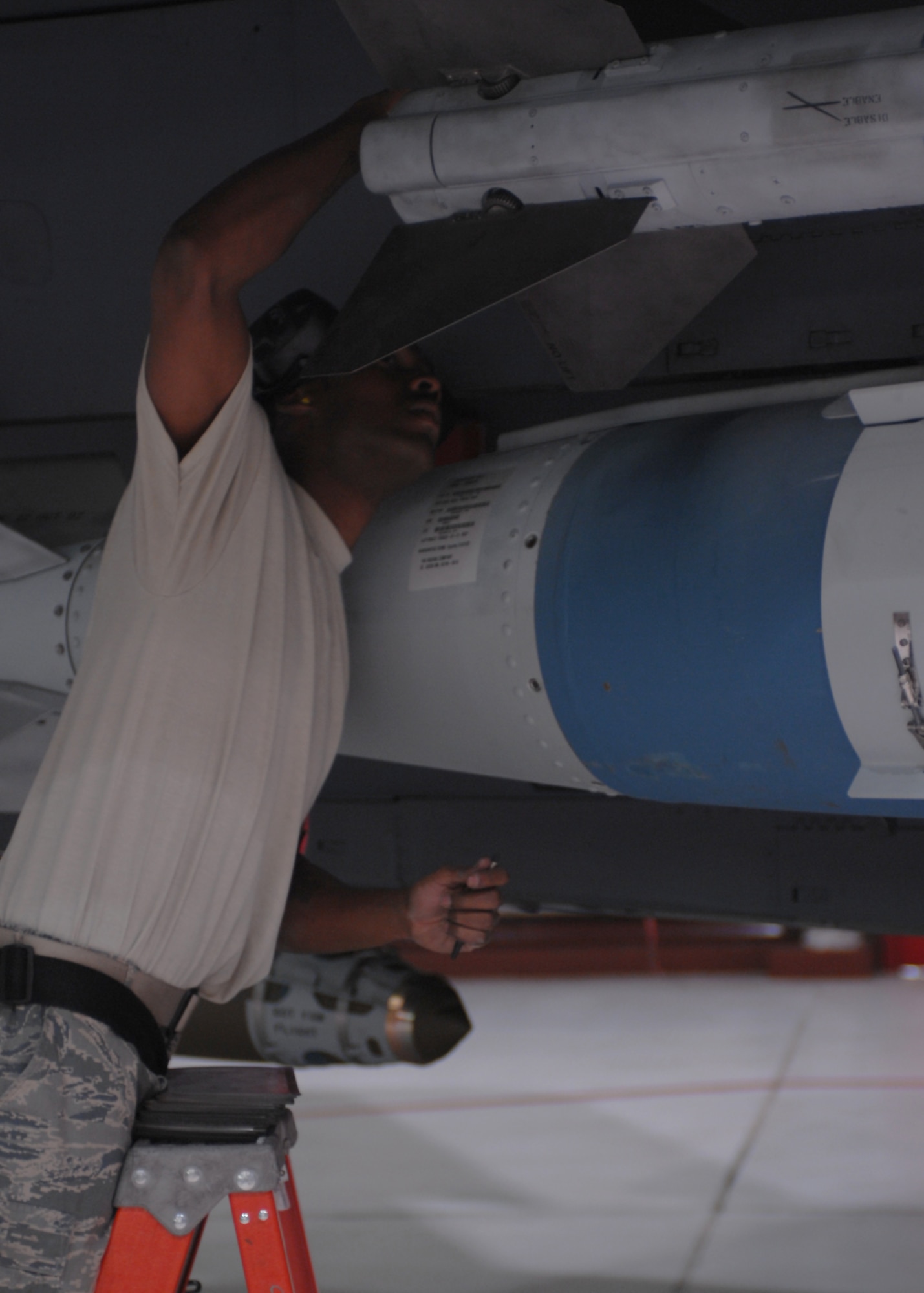 Staff sergeant Thomas Hall from the 336th Aircraft maintenance unit checks to make sure all fins on the guided bomb unit are properly attached. He is part of a weapons load competition held quarterly on base. Seymour Johnson AFB, North Carolina, February 27,2008.(United States Air Force photo by Airman First Class Ciara Wymbs)(Released)