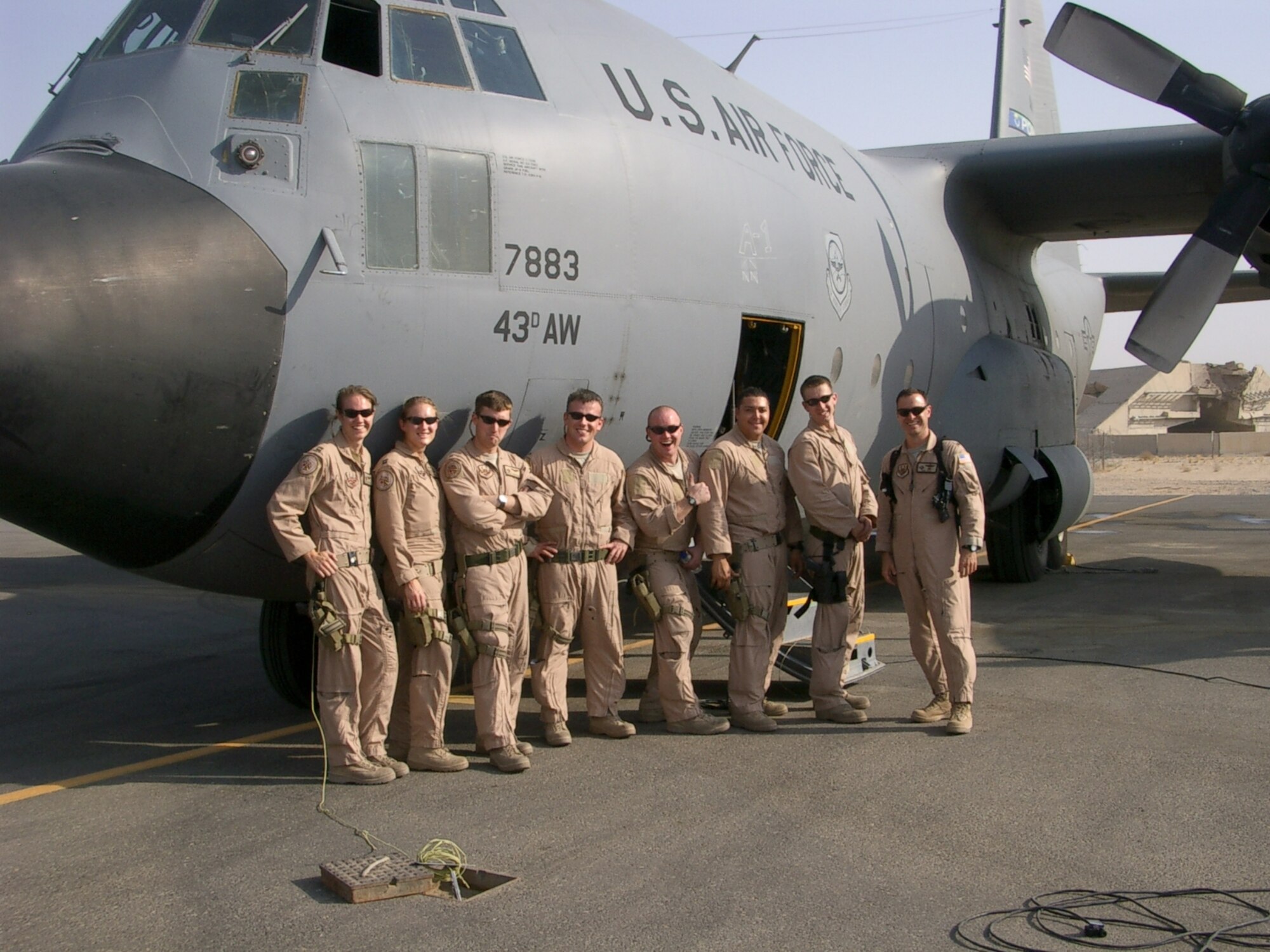 The crew of Pope's CROME 46, from left to right: Capt. Kaly Godfrey, Capt. Jessica Kehren, 1st Lt. Robert Davidson, 1st Lt. Andrew Gillis, Staff Sgt. Kyle Anderson, Staff Sgt. Charles Jones, Staff Sgt. Adam Monroy and Maj. Paul Pepe. The crew received the 2007 Air Mobility Command Field of Aeronautics and Astronautics Aviator Valor Award.