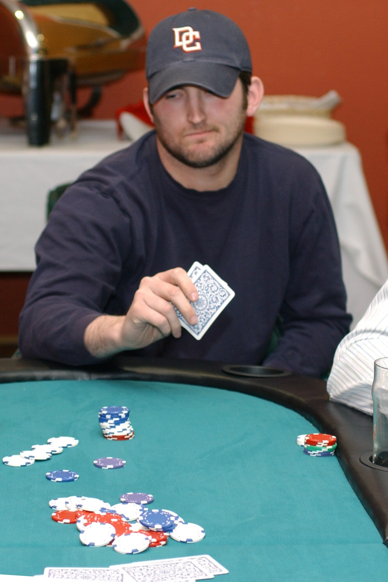 William Young, RAF Lakenheath's No Limit Texas Hold?em tournament champion, goes all in against Ken Chastain. The tournament ran for eight weeks and the winner was determined by a seated point system. Tyrone Nixon, the tournament's second seat, will represent Lakenheath in the USAFE championship at Spangdalhem Air Base, Germany March 15. He will play for a chance to win $1000 in AAFES gift certificates. (U.S. Air Force photo by Airman 1st Class Kristopher Levasseur) 