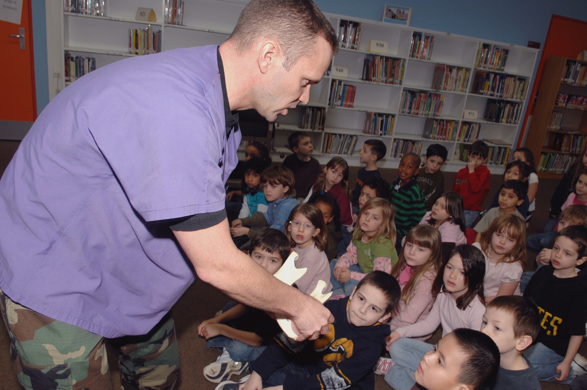 SPANGDAHLEM AIR BASE, Germany – Maj. Brian Penton, 52nd Dental Squadron, shows Spangdahlem Elementary School students proper dental care techniques Feb. 27, 2008. Members of the 52nd DS visited base schools and child development centers throughout the month as part of Children’s Dental Health Month to teach children how to take care of their teeth. (U.S. Air Force photo/Senior Airman Logan Tuttle)