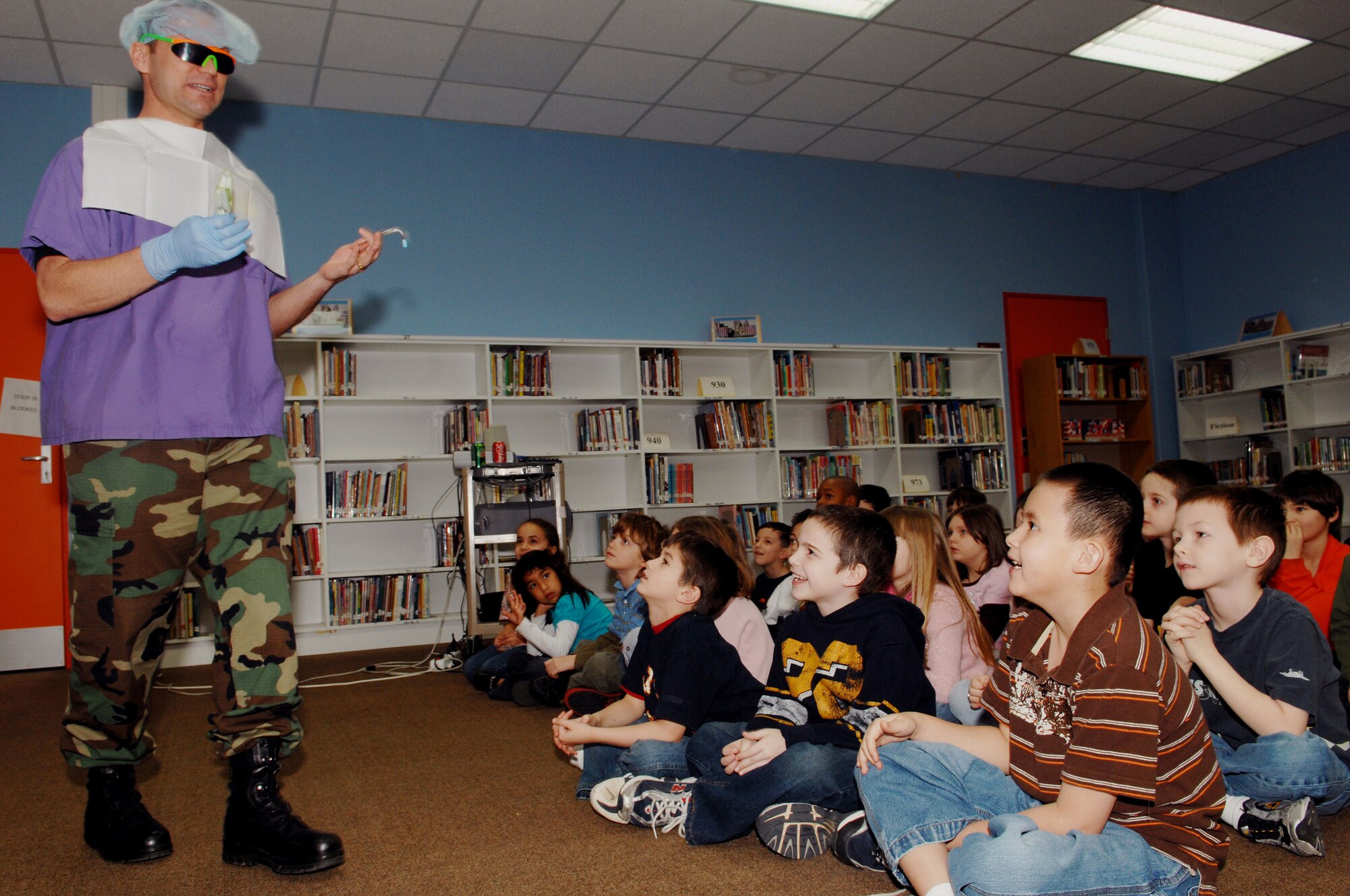 SPANGDAHLEM AIR BASE, Germany – Maj. Brian Penton, 52nd Dental Squadron, shows Spangdahlem Middle School students tools he uses to clean teeth as part of Children’s Dental Health Month, an event designed to promote proper dental care to the students Feb. 27, 2008. (U.S. Air Force photo/Senior Airman Logan Tuttle)