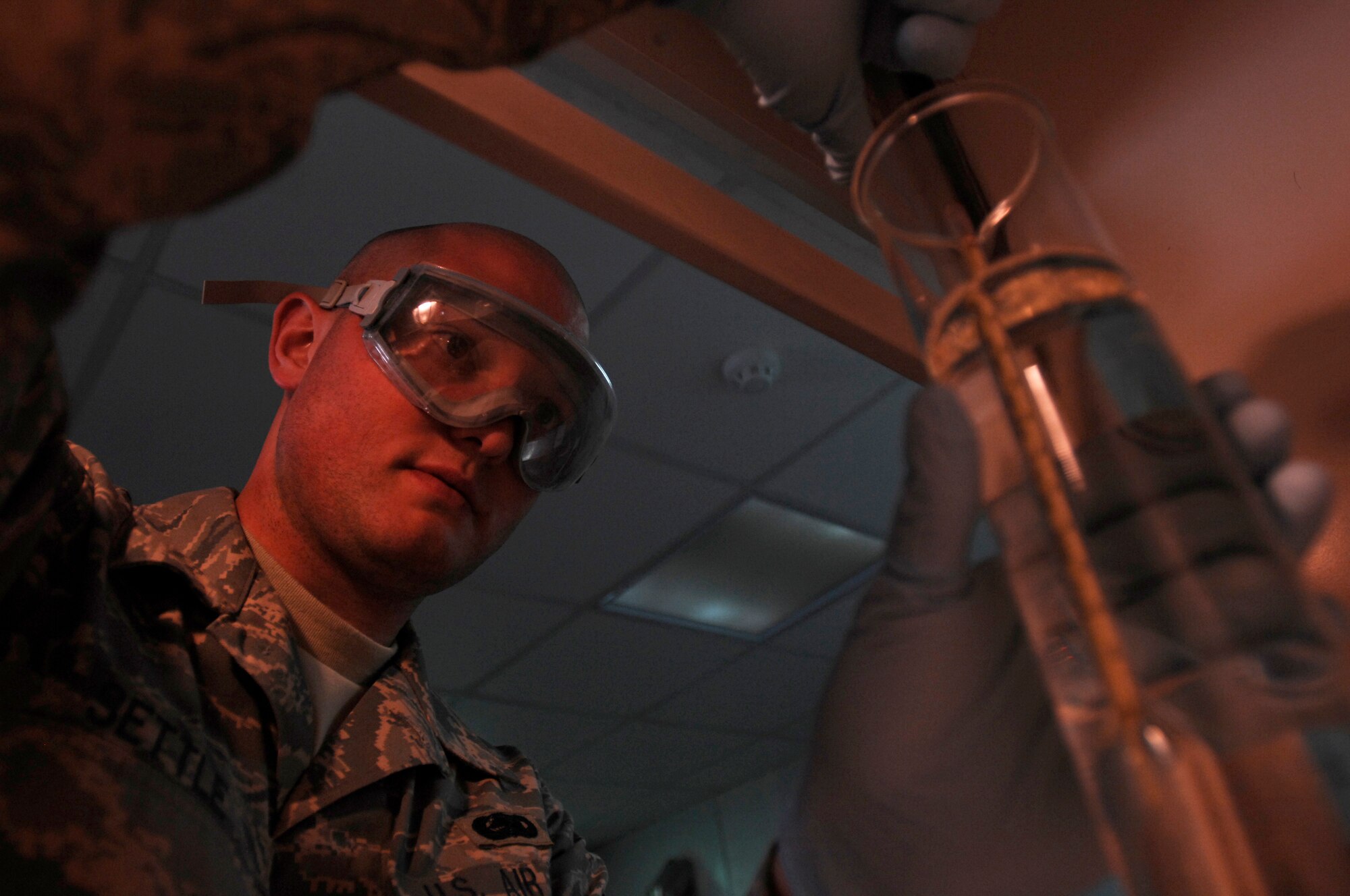 SOUTHWEST ASIA -- Staff Sgt. Frederick Settle, a fuels lab technician from the 386th Expeditionary Logistics Readiness Squadron, examines the reading on the hydrometer during an API gravity test on a sample of jet fuel at an air base in the Persian Gulf Region Feb. 27, 2008. The fuels management flight is responsible for inventorying the fuel daily, and the transfer and issue of fuel to both vehicle operators and aircrews in support of Operations Enduring and Iraqi Freedom. (U.S. Air Force photo/ Staff Sgt. Patrick Dixon)