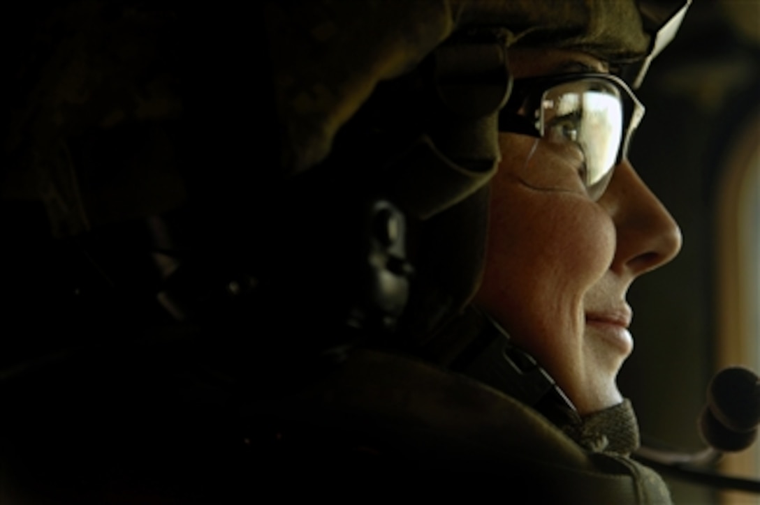 U.S. Air Force Airman 1st Class Brittany Ward waits in her tactical vehicle for a patrol of Rasheed, Iraq, on Feb. 26, 2008.  Ward is assigned to Detachment 3, 732nd Expeditionary Security Forces Squadron, Sather Air Base, Iraq.  