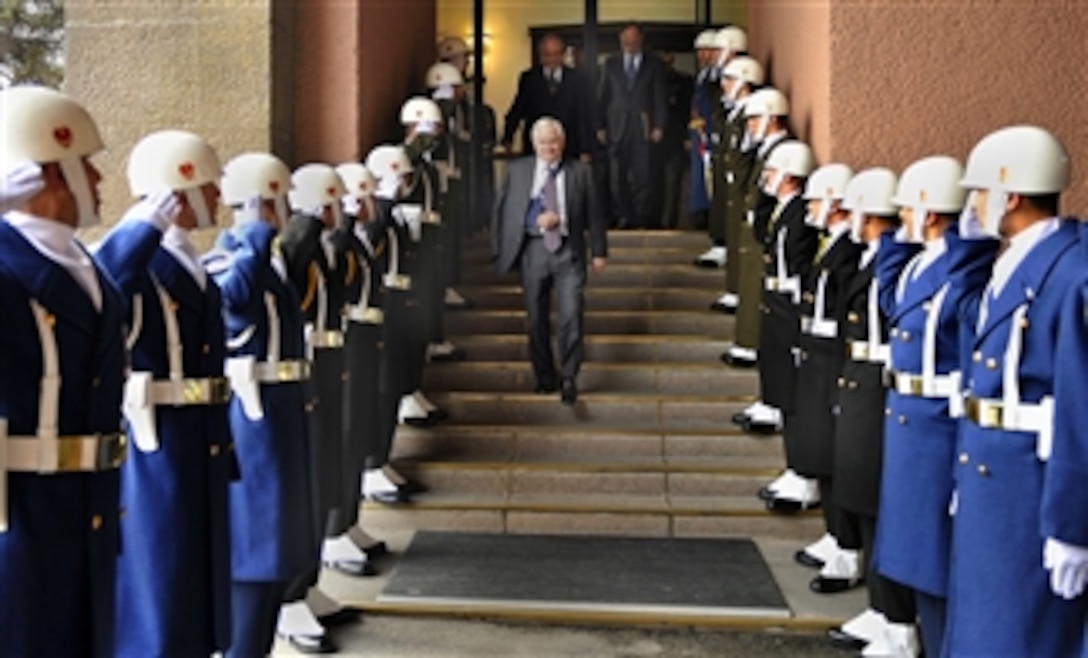 Defense Secretary Robert M. Gates walks through an honor cordon while departing at the Turkish Ministry of Defense in Ankara, Turkey, Feb. 28, 2008.  