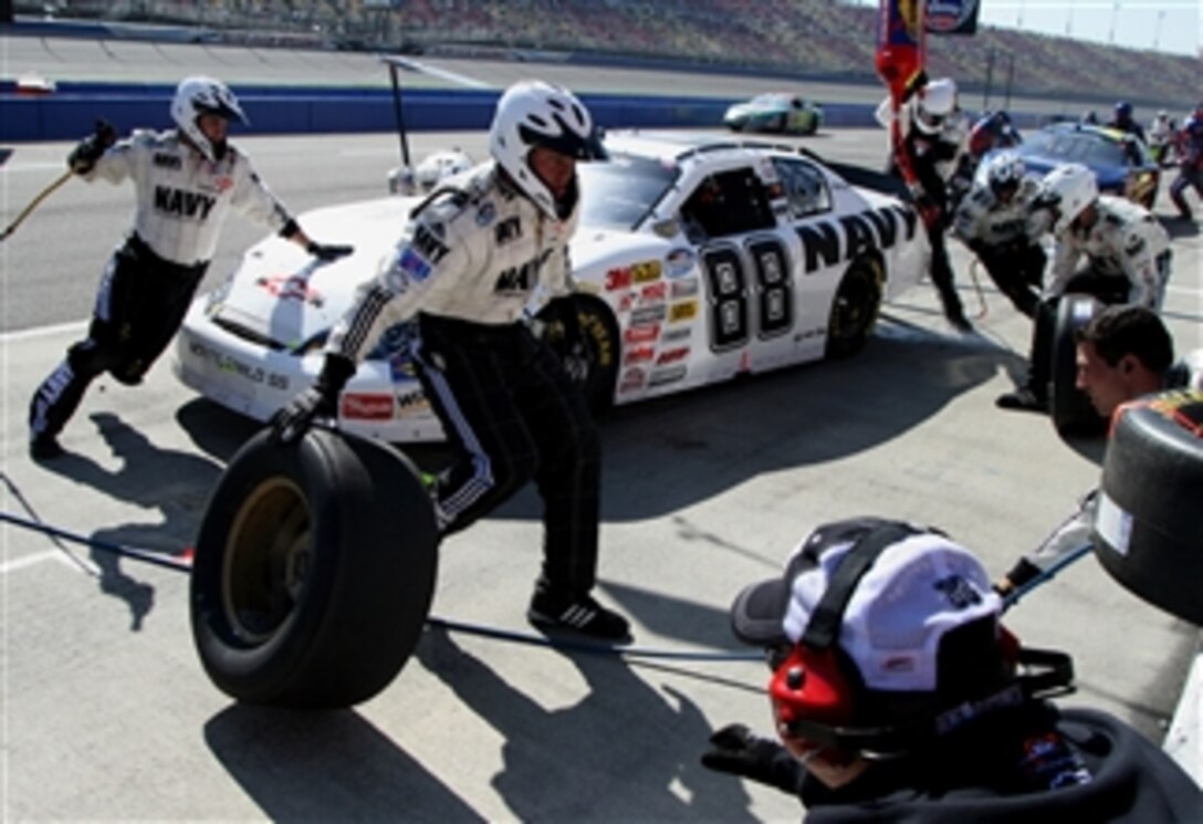 The U.S. Navy NASCAR team services the No. 88 Navy Accelerate Your Life Monte Carlo during the Stater Brothers 300 at California Speedway, in Fontana, Calif. Feb. 25, 2008.  A late-race transmission failure relegated Navy driver Brad Keselowski to 32nd in the race. 