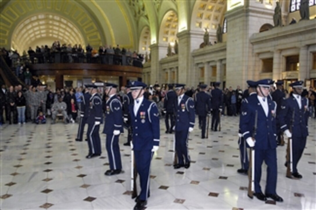 Air Force Honor Guard Drill Team members perform their new "four-corners" drill sequence, which represents the global reach of the Air Force, at Union Station in Washington, D.C. Feb. 21, 2008. The "unveiling drill" is the first drill of the year and the formal presentation of the 2008 team. 