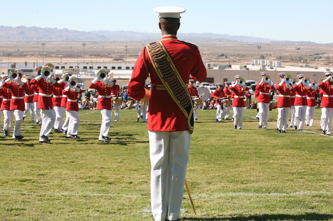 The Drum and Bugle Corps drum major directs his Marines during the Battle Color Ceremony aboard the Combat Center at Lance Cpl. Torrey L. Gray Field Beb. 29.  They played an assortment of traditional Marine Corps music including a very well-known band standard ?Malague?a? by Ernesto Lecuona.  The Drum and Bugle Corps, also known as the ?Commandant?s Own? is stationed at Marine Barracks, Washington, D.C.