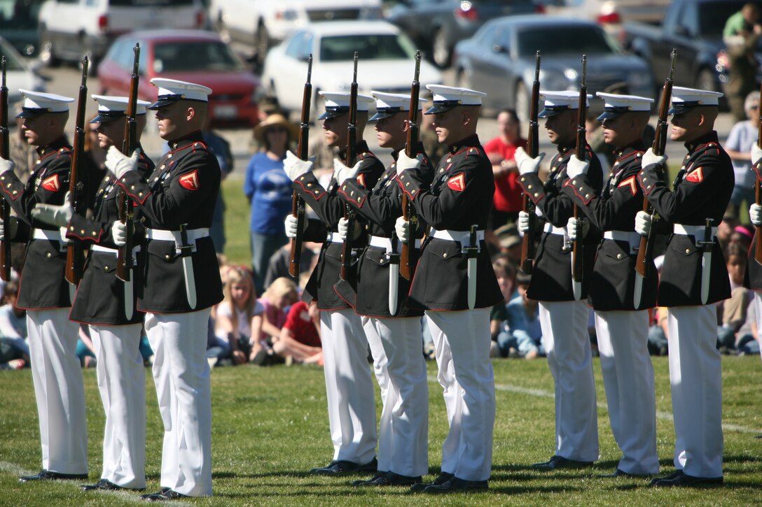 The United States Marine Corps Silent Drill Platoon executes precise drill movements without cadence or command during the Battle Color Ceremony Feb. 29 at Lance Cpl. Torrey L. Gray Field.  The Silent Drill Platoon is made up of 24 hand-picked, highly-trained Marines that carry M-1 Garand Rifles with bayonets attached. The Marines are trained to spin, toss and catch these rifles in synchronized order within mere inches of the Marine next to him.