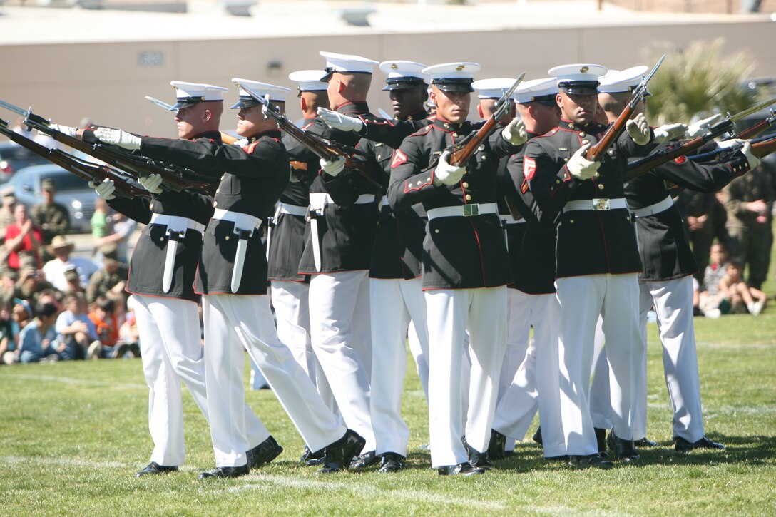 The United States Marine Corps Silent Drill Platoon executes precise drill movements without cadence or command during the Battle Color Ceremony Feb. 29 at Lance Cpl. Torrey L. Gray Field.  The Silent Drill Platoon is made up of 24 hand-picked, highly-trained Marines that carry M-1 Garand Rifles with bayonets attached. The Marines are trained to spin, toss and catch these rifles in synchronized order within mere inches of the Marine next to him.