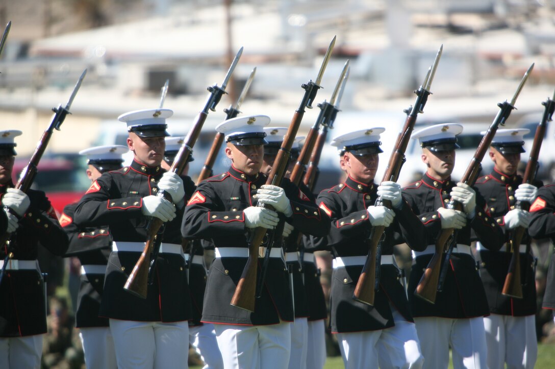 The United States Marine Corps Silent Drill Platoon executes precise drill movements without cadence or command during the Battle Color Ceremony Feb. 29 at Lance Cpl. Torrey L. Gray Field.  The Silent Drill Platoon is made up of 24 hand-picked, highly-trained Marines that carry M-1 Garand Rifles with bayonets attached. The Marines are trained to spin, toss and catch these rifles in synchronized order within mere inches of the Marine next to him.