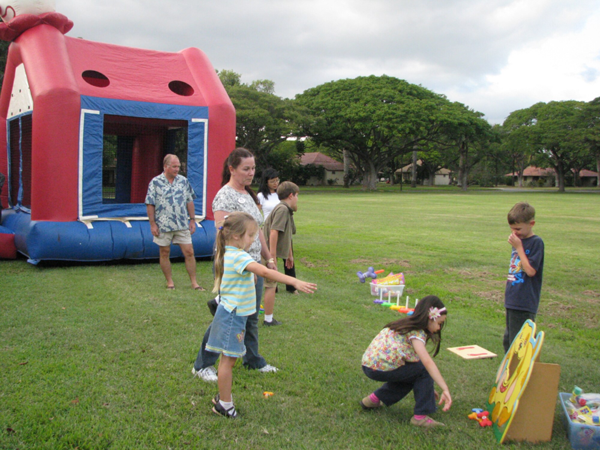 Enjoys the game during the monthly activity dinner at Hickam Nelles Chapel. 