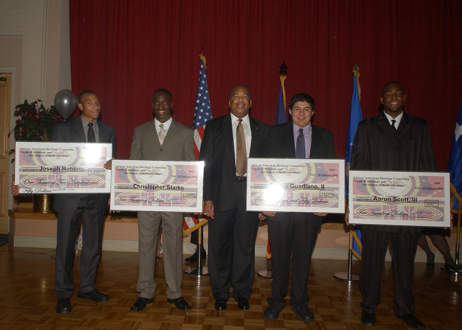 Recipients of the African American Heritage Committee scholarships pictured with retired Lt. Gen. John Hopper, the guest speaker for the AAHC Scholarship Banquet on Feb. 22, are (from left) Joseph S. Roberts, Christopher E. Starks, Phillip Guadiano II and Aaron Scott III. Mr. Roberts of John Marshall H.S. was the 2nd place winner and received a $1,250 scholarship award. He plans to attend Houston Baptist University. Mr. Starks of Earl Warren H.S. was the 1st place winner and received a $2,000 scholarship award. He plans to attend Texas A&M University. Mr.Guadiano of Sandra Day O'Conner H.S. was the 3rd place winner and received a $750 scholarship award. He plans to attend Texas A&M University. Mr. Scott of John Jay Science and Engineering Academy was the 4th place winner and received a $500 scholarship award. He plans to attend University of Texas-San Antonio. (USAF photo by Alan Boedeker)                              