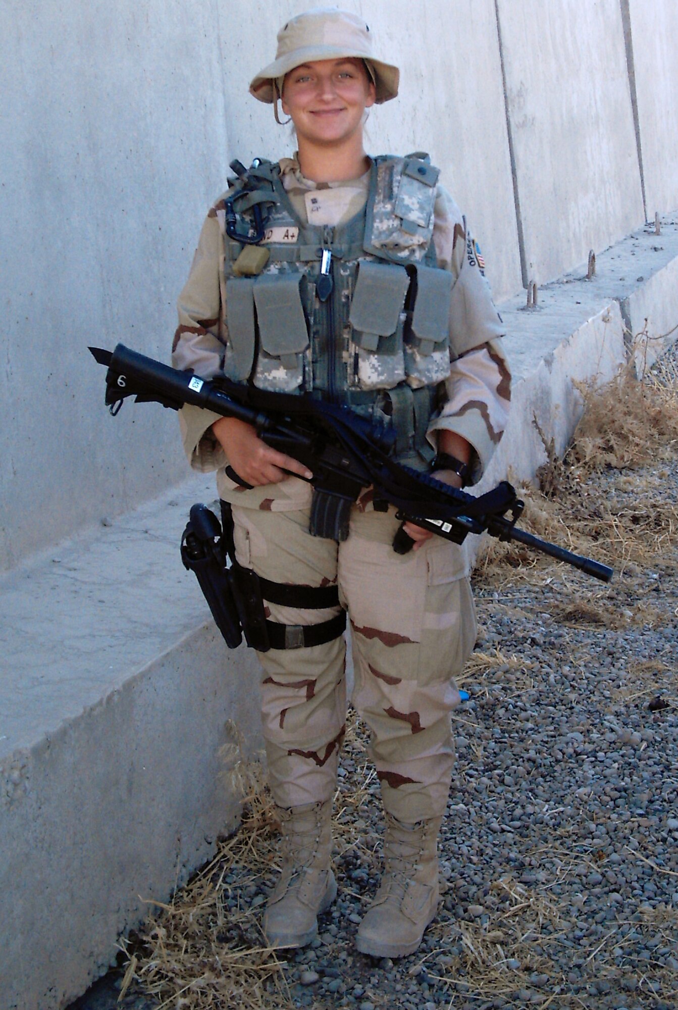 Staff Sgt. Bridget Lund, 442nd Security Forces Squadron, patrols the perimeter of Kirkuk Air Base, Iraq, in November 2007.  More than 20 members of the 442nd SFS were deployed to Kirkuk Air Base, Iraq, to provide base security and conduct combat operations there.  The members returned home to Whiteman Air Force Base, Mo., Feb. 29, 2008.  The 442nd SFS is an Air Force Reserve unit based at Whiteman. (Courtesy Photo) 