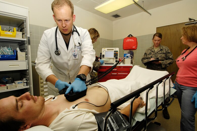 VANDENBERG AIR FORCE BASE, Calif. -- Capt. (Dr.) Daniel Rohweder, a family practice physician with the 30th Medical Group, gives a patient suffering from a simulated heart attack shock treatment during a code blue exercise on Feb. 28. Code blue is used to indicate a patient with injuries or illnesses that present an immediate life-threatening emergency, most often a cardiac arrest. The medical group has monthly training days to ensure that they are prepared for any situation that may come their way. (U.S. Air Force photo/Airman 1st Class Christian Thomas)



