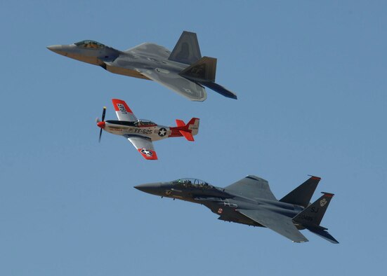 A F-22 Raptor, P-47 Thunderbolt, and F-15E fly in formation as part of a aerial demonstration during the 2007 Heritage Conference at Davis-Monthan AFB, March 3, 2007. The Heritage Conference provides an opportunity for Air Combat Command demonstration pilots to train together with modern and historic military aircraft in preparation for the upcoming air show seasons. (U.S. Air Force photo by Senior Airman Christina D. Kinsey)