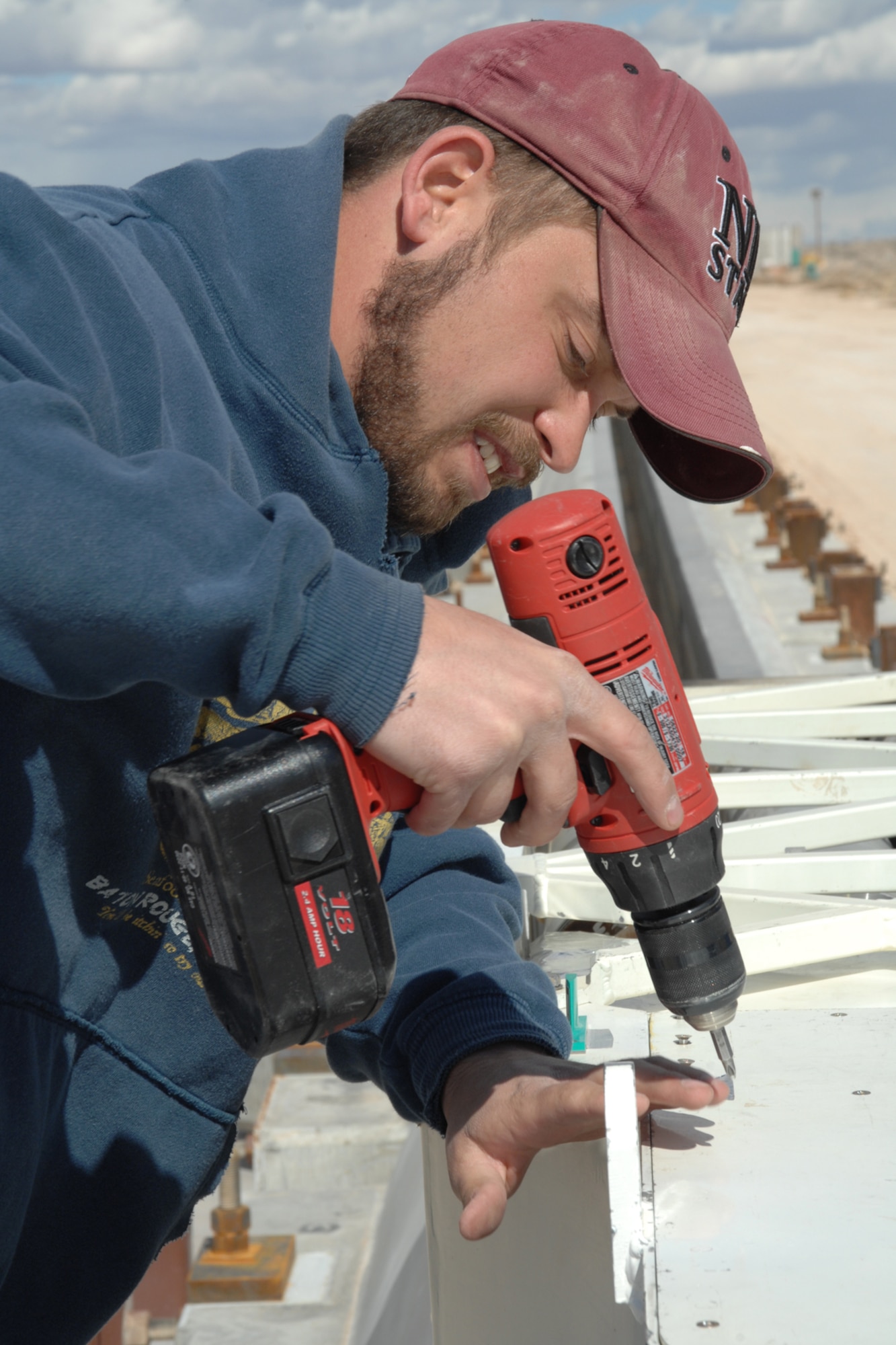 Greg Waterhouse, electronics technician, removes top panel screws of a magnetically levitated rocket sled after a successful test Feb. 21, 2008, at Holloman Air Force Base, N.M. Initial data stated the rocket sled reached a speed of 423 miles per hour, breaking the previous record of 361 miles per hour. (U.S. Air Force photo/Airman 1st Class Jamal D. Sutter)
