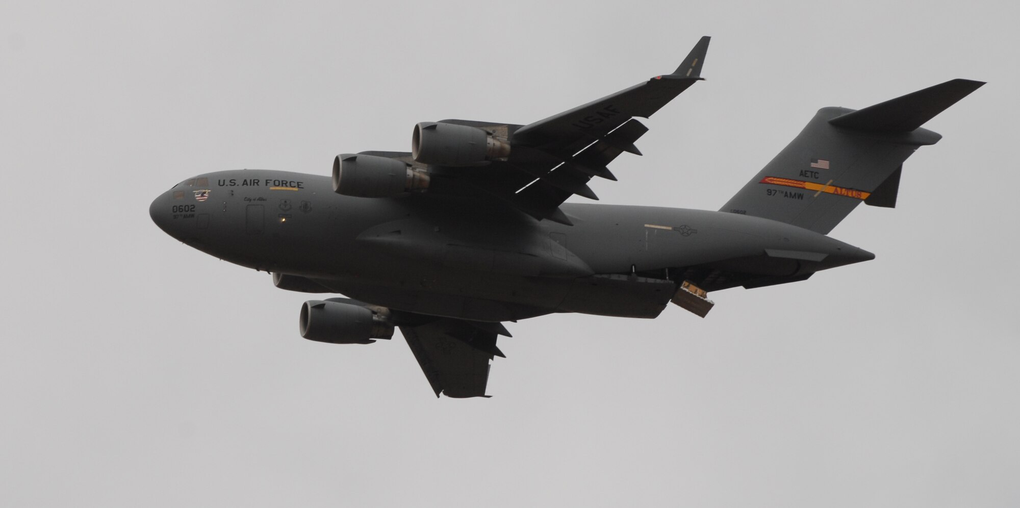 ALTUS AIR FORCE BASE, Okla. -- A cargo pallet begins to slide out of an Altus AFB C-17 Globemaster III during an airdrop exercise at Duke, Okla., Feb. 28. Two C-17s dropped several pallets during the exercise. (U.S. Air Force Photo/Airman 1st Class Rebecca Talley)