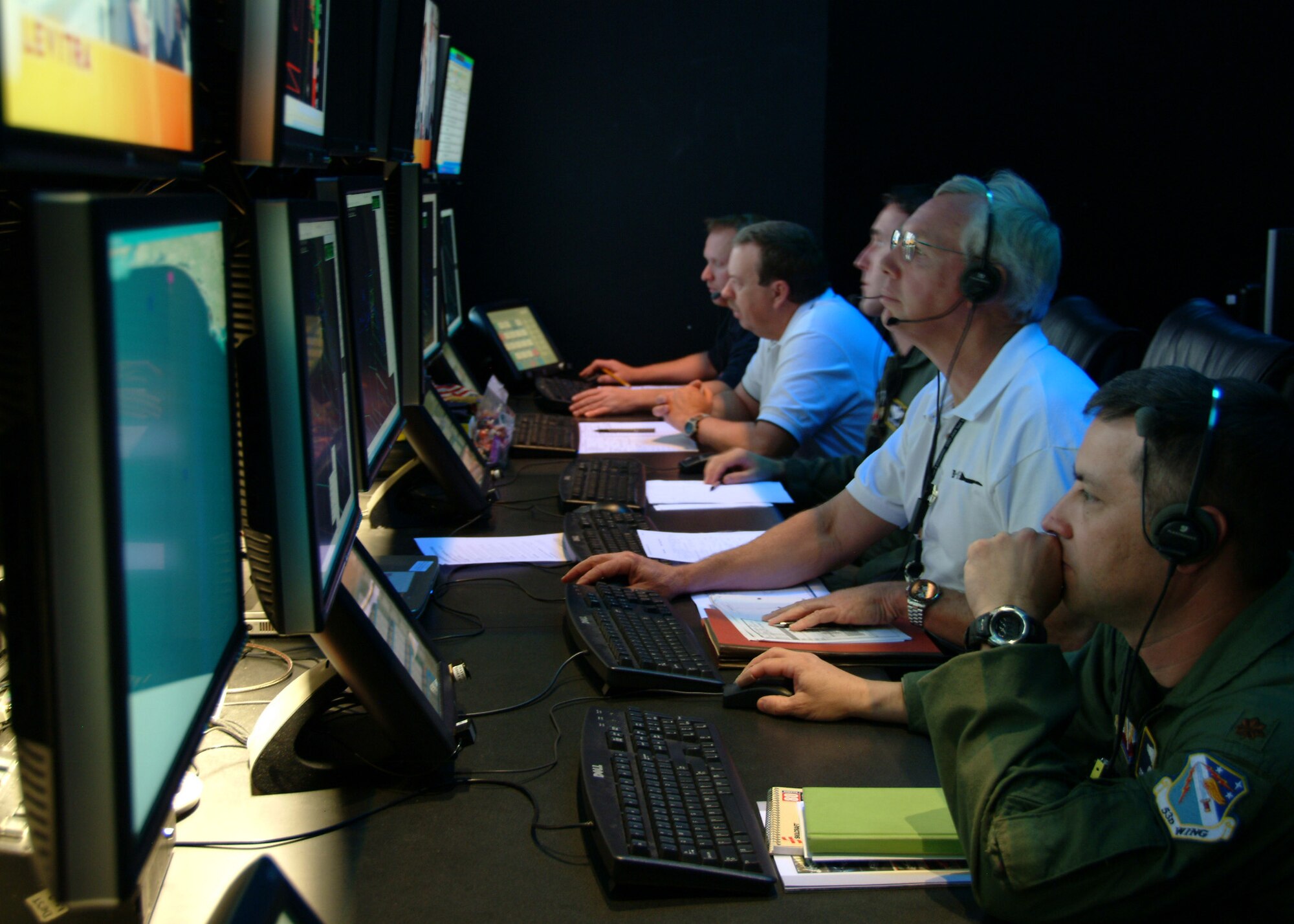 EGLIN AIR FORCE BASE, Fla. – Analysts and engineers from the 53d Wing monitor the B-1 Tail Warning Function test at the Central Control Facility at Eglin Air Force Base, Fla., Feb. 25. The TWF is a radar that faces the rear of B-1 to detect incoming missiles or aircraft. If detected the system can deploy defensive countermeasures. Crews from the 337th Test and Evaluation Squadron, Dyess Air Force Base, Texas, and fellow 53d Wing aircrew flew the B-1 mission at the Eglin range. (U.S. Air Force photo Capt. Carrie Kessler)