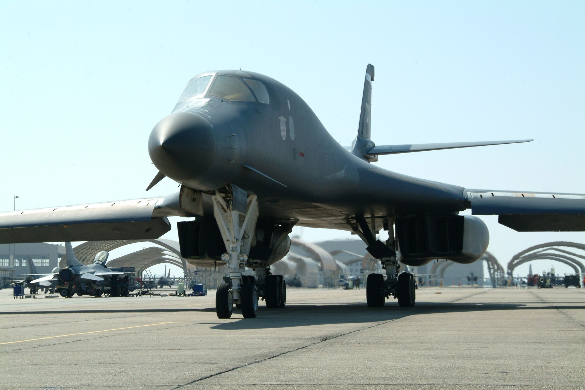 EGLIN AIR FORCE BASE, Fla. – A B-1B Lancer from the 337th Test and Evaluation Squadron, Dyess Air Force Base, Texas, awaits a mission at Eglin Air Force Base, Fla. The bomber was at Eglin for a B-1 Tail Warning Function test Feb. 25. The four-person crew flew the conducted at the Eglin range Feb. 25. The TWF is a radar that faces the rear of B-1 to detect incoming missiles or aircraft. If detected the system can deploy defensive countermeasures. (U.S. Air Force photo Capt. Carrie Kessler)
