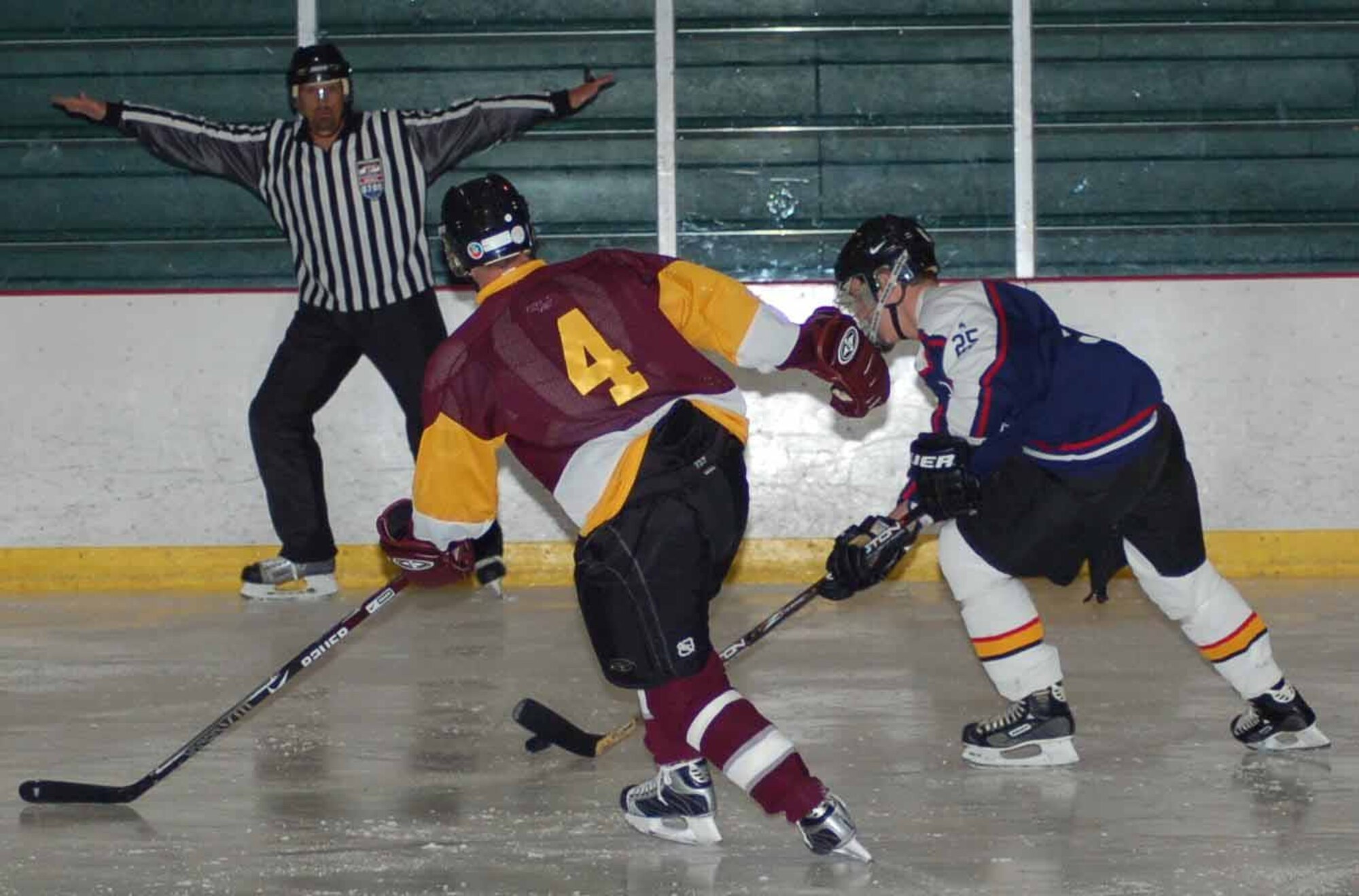 Tinker Hawks I defenseman Jon Ellysen, right, skates with Chesepeake forward Peter Show in the first period of a game at the Blazers Ice Centre on Feb. 24.  The Hawks lost 5-1.  (Air Force photo by John E. Banks)