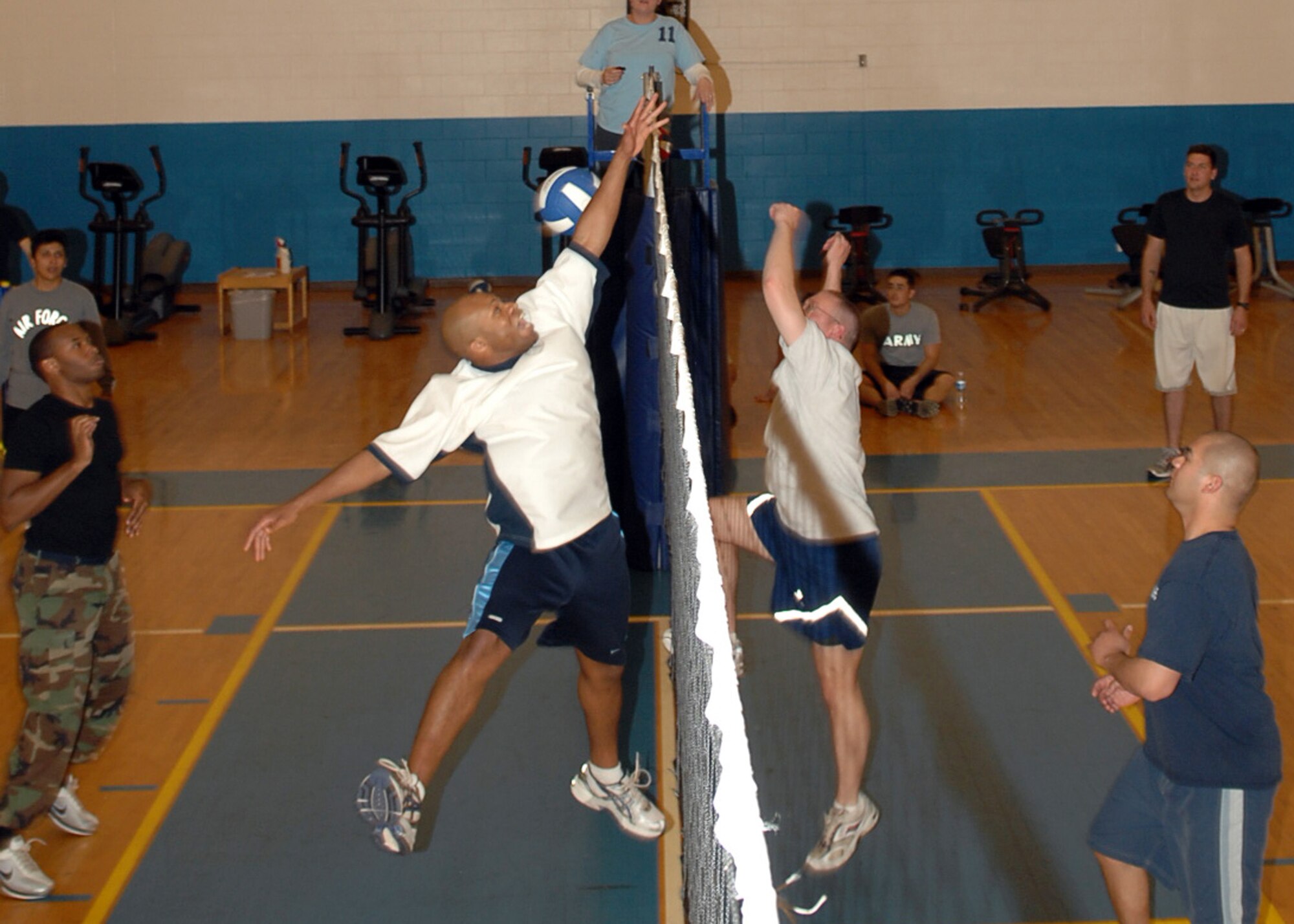 CANNON AIR FORCE BASE, N.M. -- 2nd Lt. Xzavior Hill, 27th Special Operations Civil Engineering Squadron, misses the block by Senior Airman Scott Labonte, 27th Special Operations Maintenance Operations Squadron, during the Company Grade Officer, Airman Leadership School class 2008-D volleyball game.Each ALS class competes against the CGO's in a sporting event allowing the officers to interact with the upcoming non commisoned officers.(U.S. Air Force photo by Airman Basic Danielle Martin)