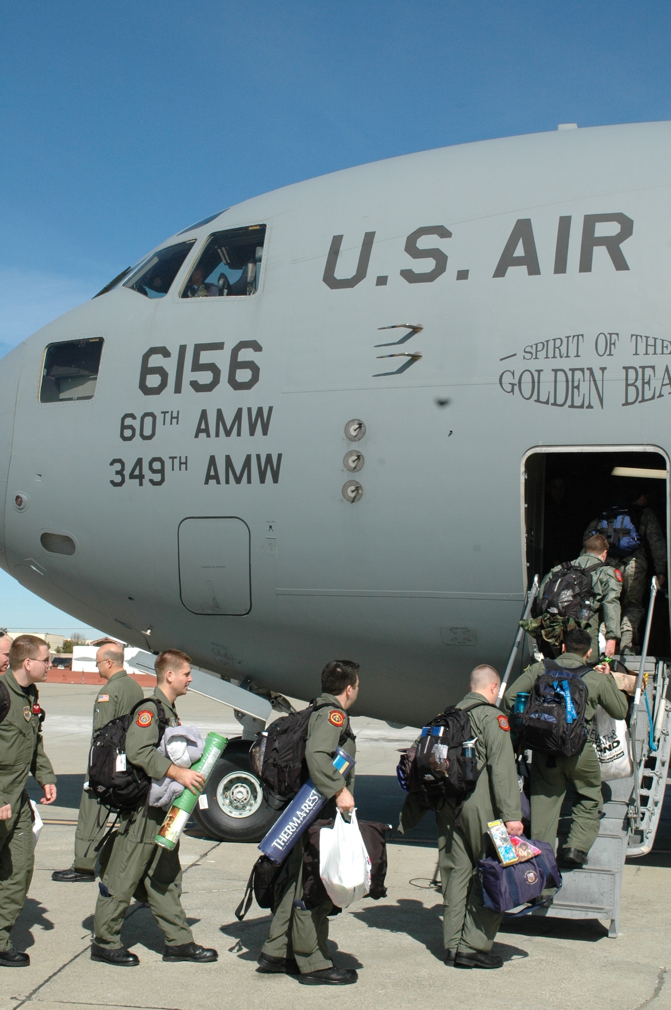 Airmen from the 21st Airlift Squadron board a C-17 Globemaster III during the squadron’s first ever collective deployment in support of the Global War on Terrorism. (U.S. Air Force photo/Tech. Sgt. Matthew McGovern)