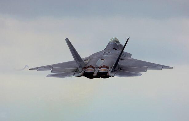 A F-22 Rapter takes off at Tyndall AFB, Fla., the next stop for the four new fighter pilots. (Air Force photo by Tech. Sgt. Matthew Hannen)