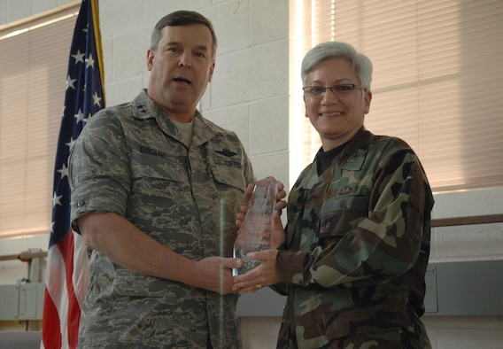 4th Air Force Commander Maj. Gen. Robert Duignan presents 445th Maintenance Group Commander Col. Anna Schulte the Chief Master Sgt. James K. Clouse Maintenance Excellence Trophy at March Air Reserve Base, Calif., Feb. 26, 2008.