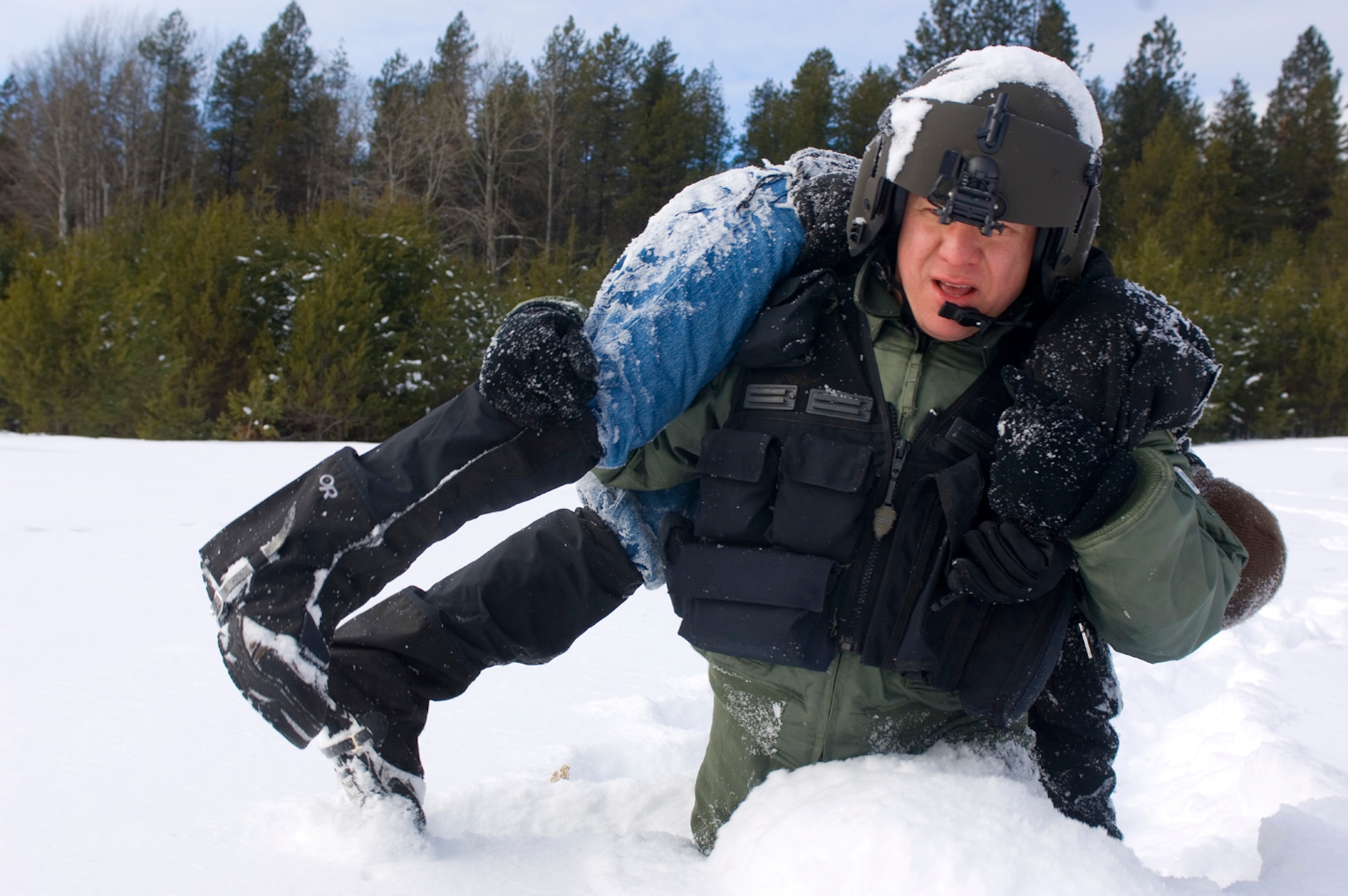 Resistance training? Much like in this training scenario, Staff Sgt. Jason Weiss had to carry a 176-pound man through waist-deep snow during a december rescue. (Air Force photo by Tech. Sgt. Matthew Hannen)