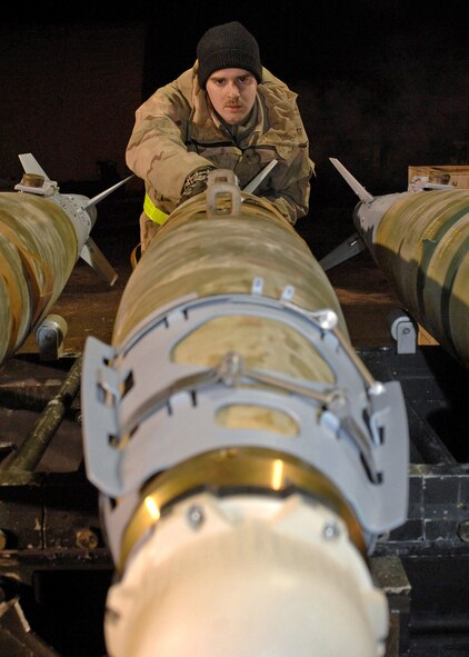 Airman 1st Class Ryan Thompson aligns a GBU-38 bomb at Bagram Air Base, Afghanistan, Feb. 14. The Airman is with the 455th Expeditionary Maintenance Squadron. (U.S. Air Force photo/Master Sgt. Demetrius Lester)